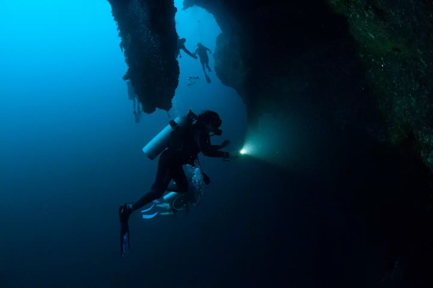 Divers exploring the Great Blue Hole have made some amazing discoveries, and also some disturbing ones. (Andre Seale/VW PICS/Universal Images Group via Getty Images)