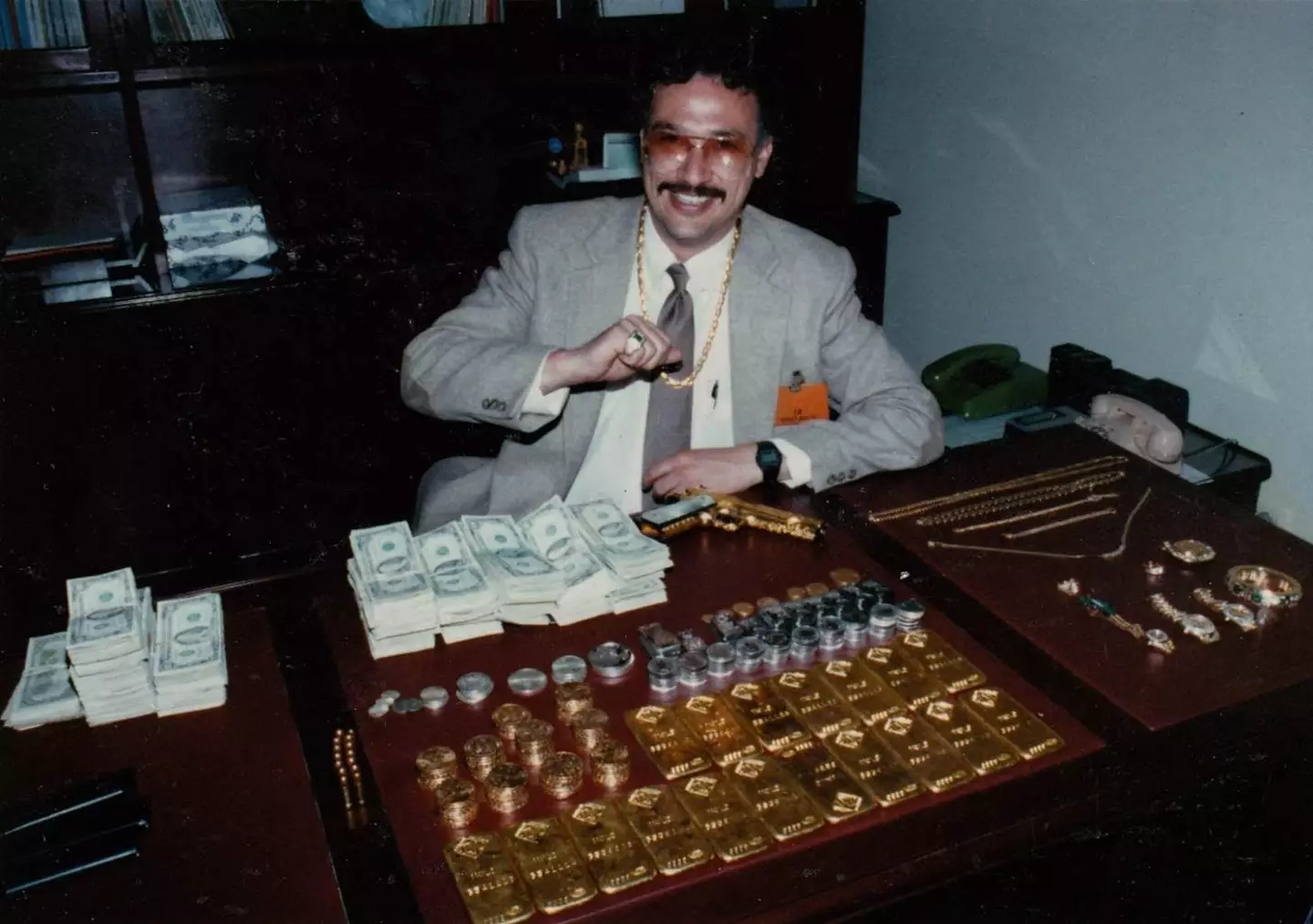 Pena, pictured next to a mountain of seized gold, was shocked by the violence he encountered.