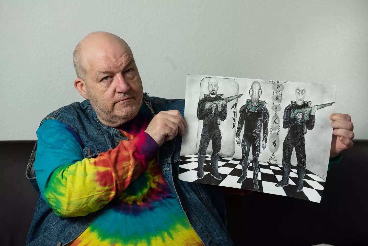 Russ Kellett and his drawings of the aliens.