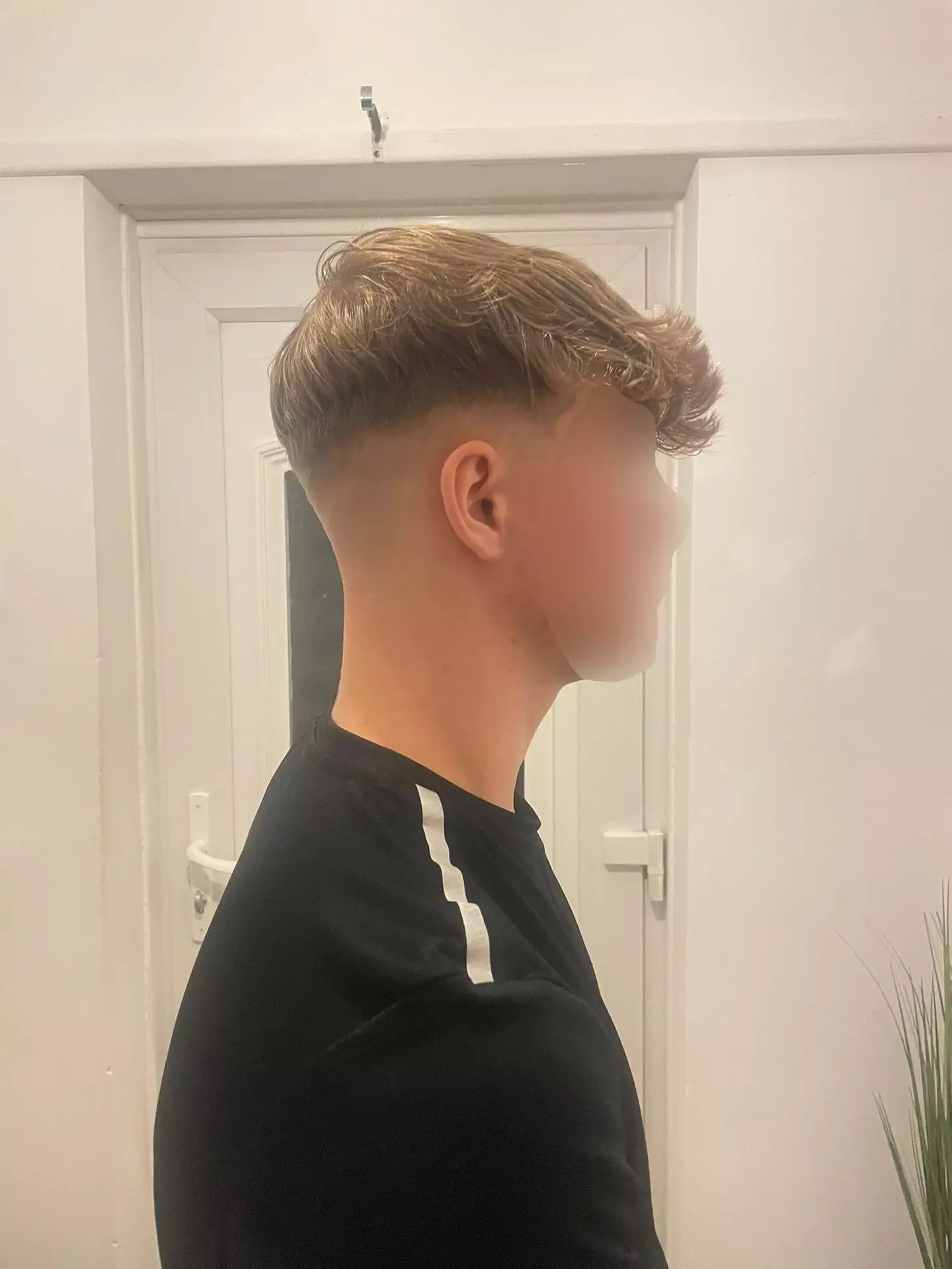 15-year-old Liam got a skin fade haircut and was punished by his school for it. (SWNS)