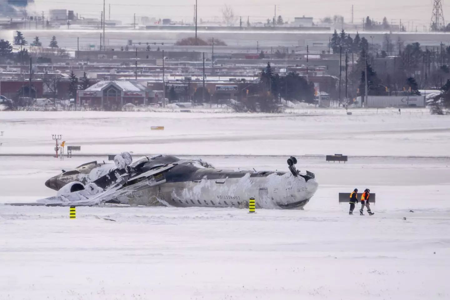 The passengers and crew survived despite Delta Flight 4819 flipping on the runway (Katherine KY Cheng/Getty Images)