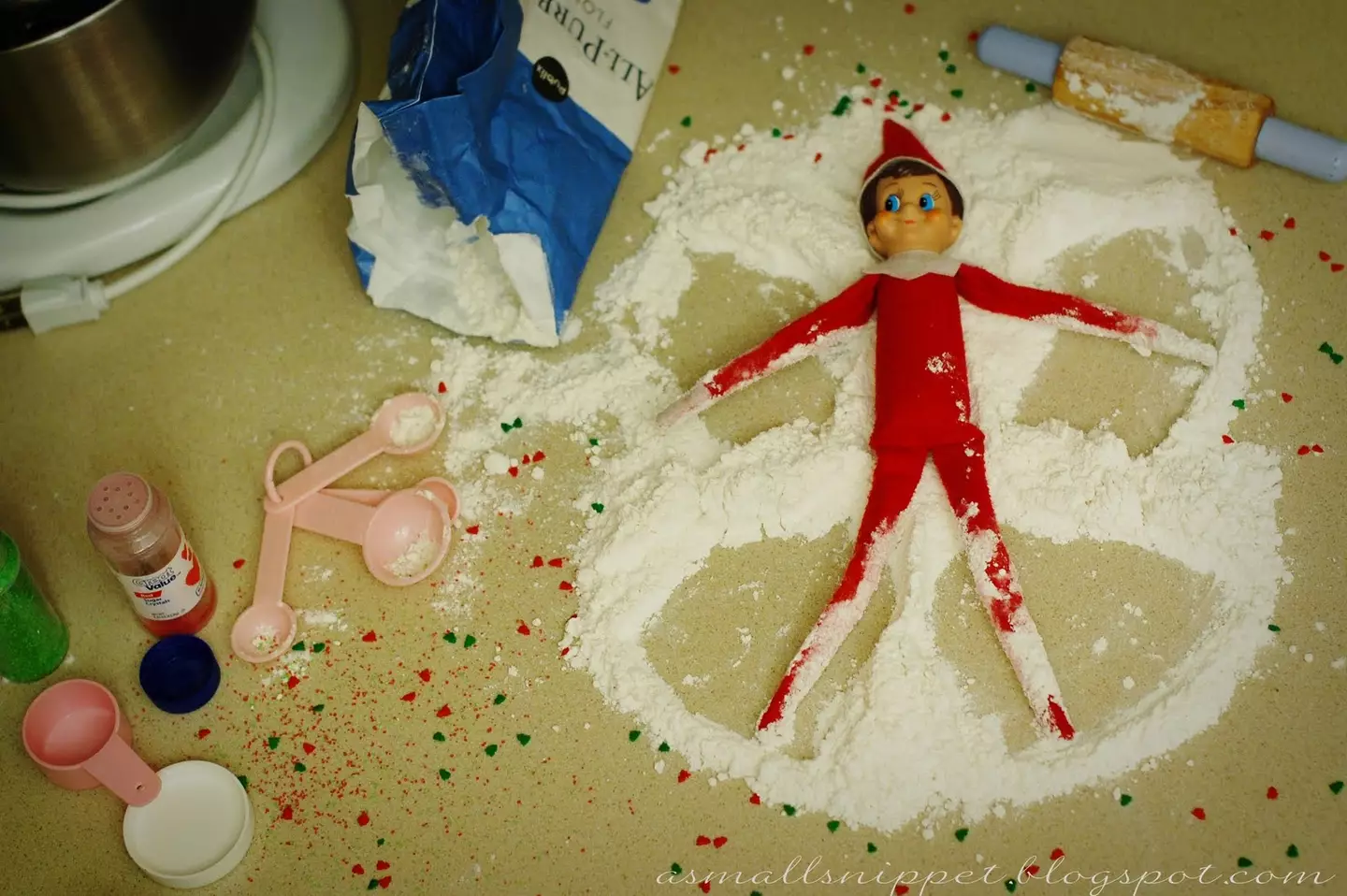 Elf making snow angels. (