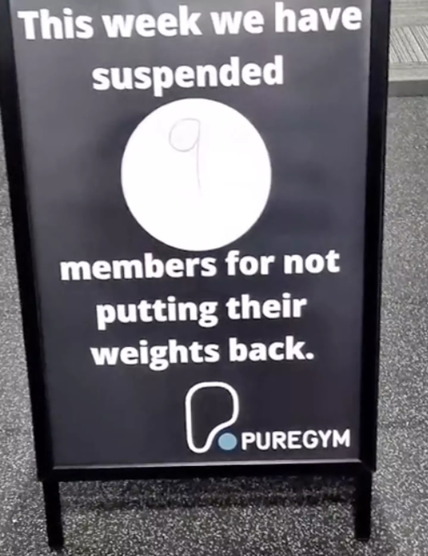 The other side of the sign revealed nine members had already been suspended that week for failing to put away their weights.