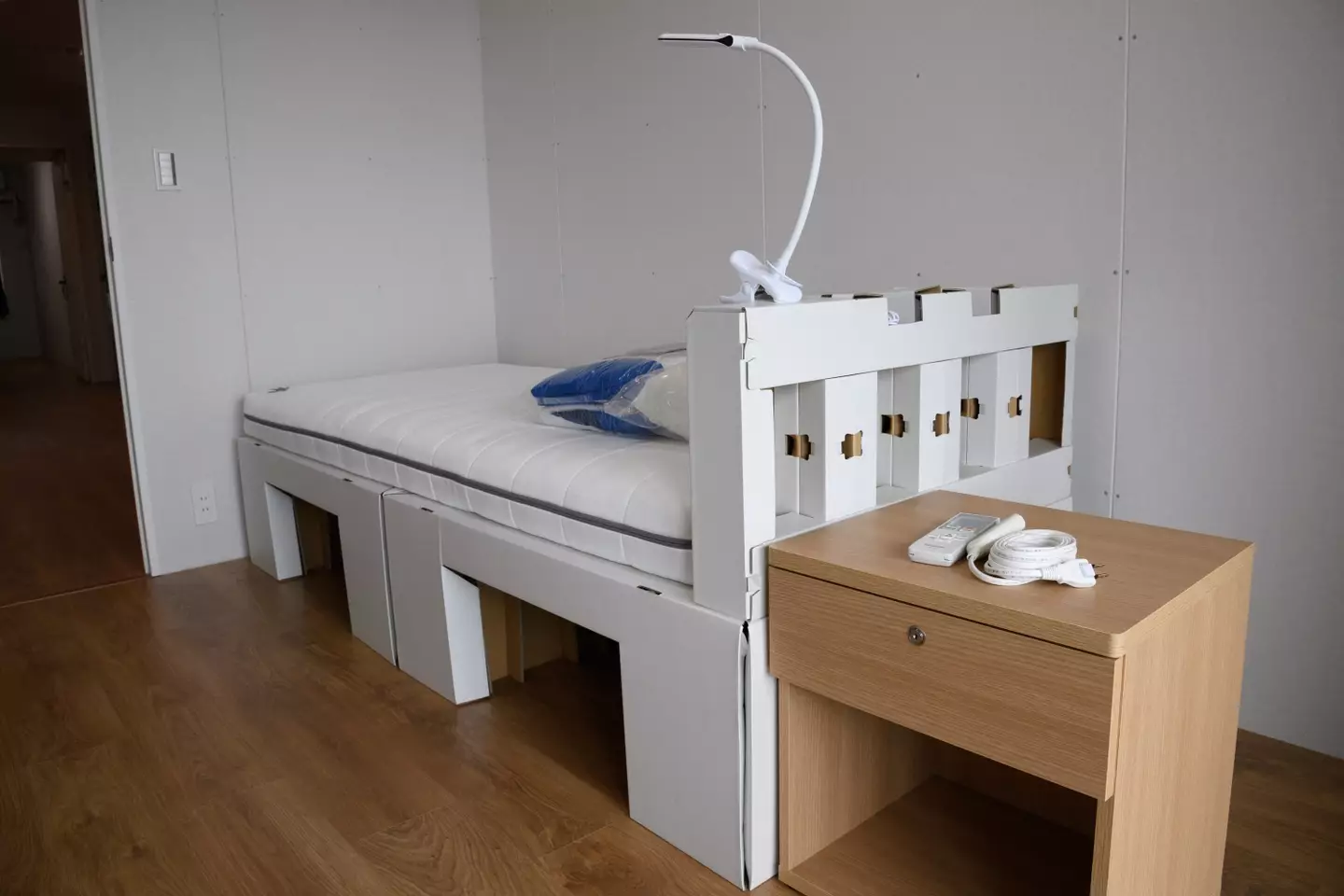 The beds are made of cardboard but that's so they can be recycled, not to stop the athletes from having sex in them. (AKIO KON/POOL/AFP via Getty Images)