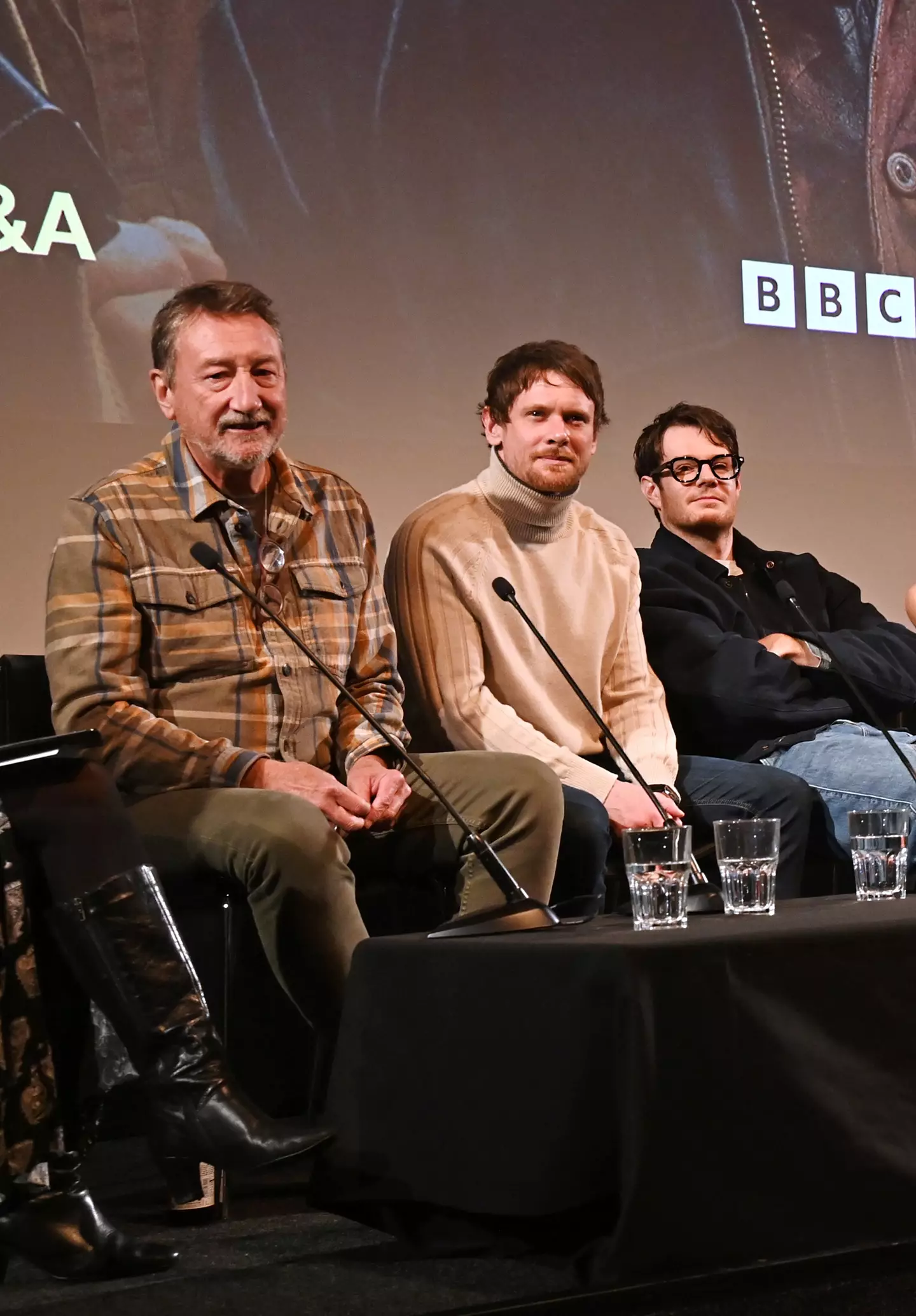 Steven Knight alongside the show's co-stars Jack O'Connell and Connor Swindells (Dave Bennet via Getty Images)