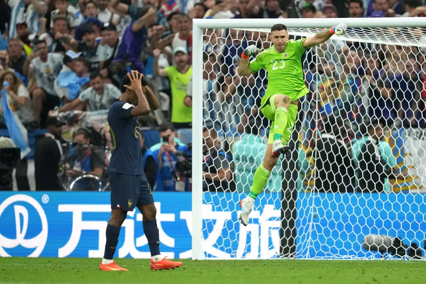Argentina goalkeeper Emiliano Martinez (right) celebrates after saving France's Kingsley Coman's penalty in the penalty shoot-out after extra time during the FIFA World Cup final at Lusail Stadium, Qatar.