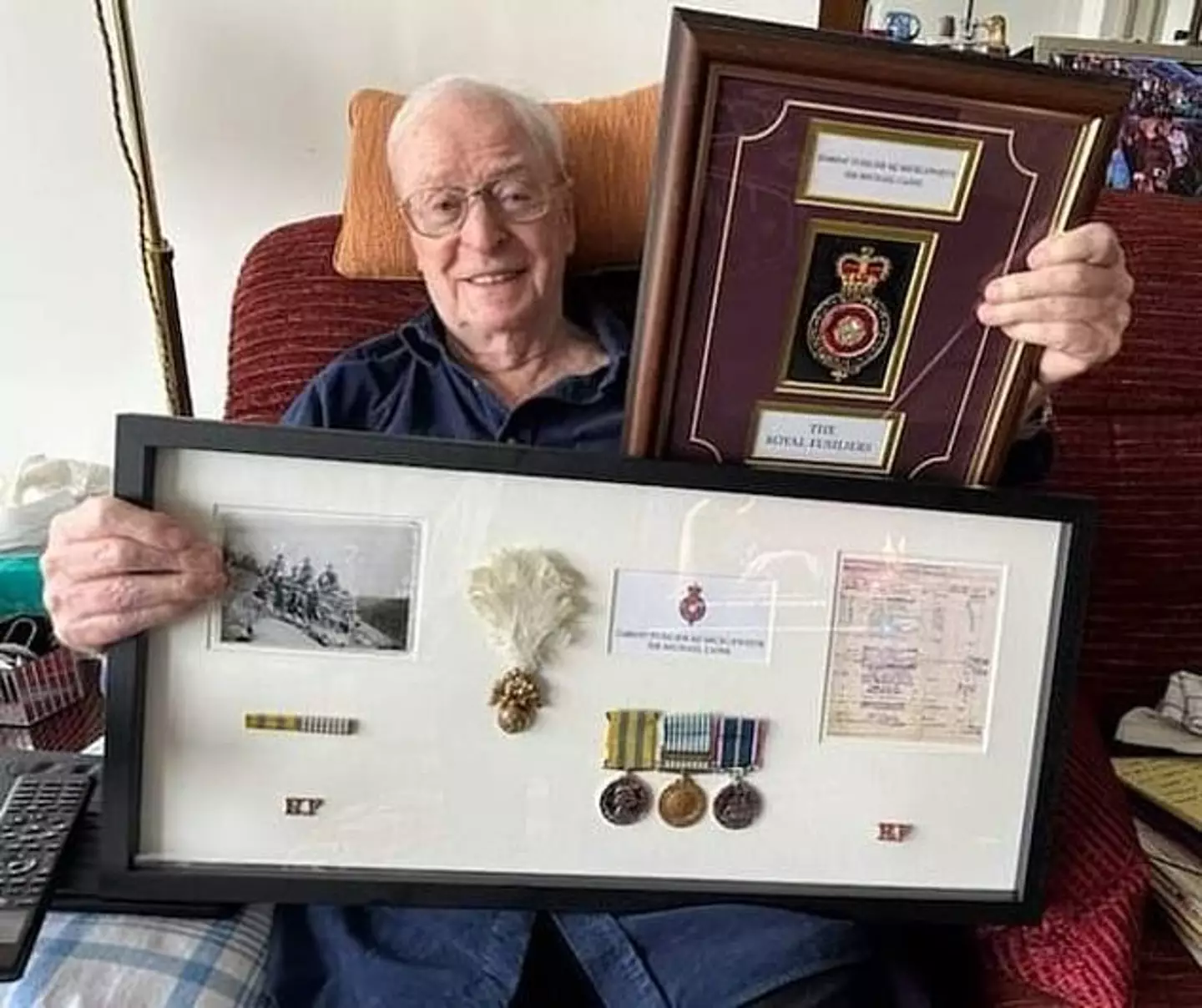 Sir Michael received the presentation box for his 90th birthday.