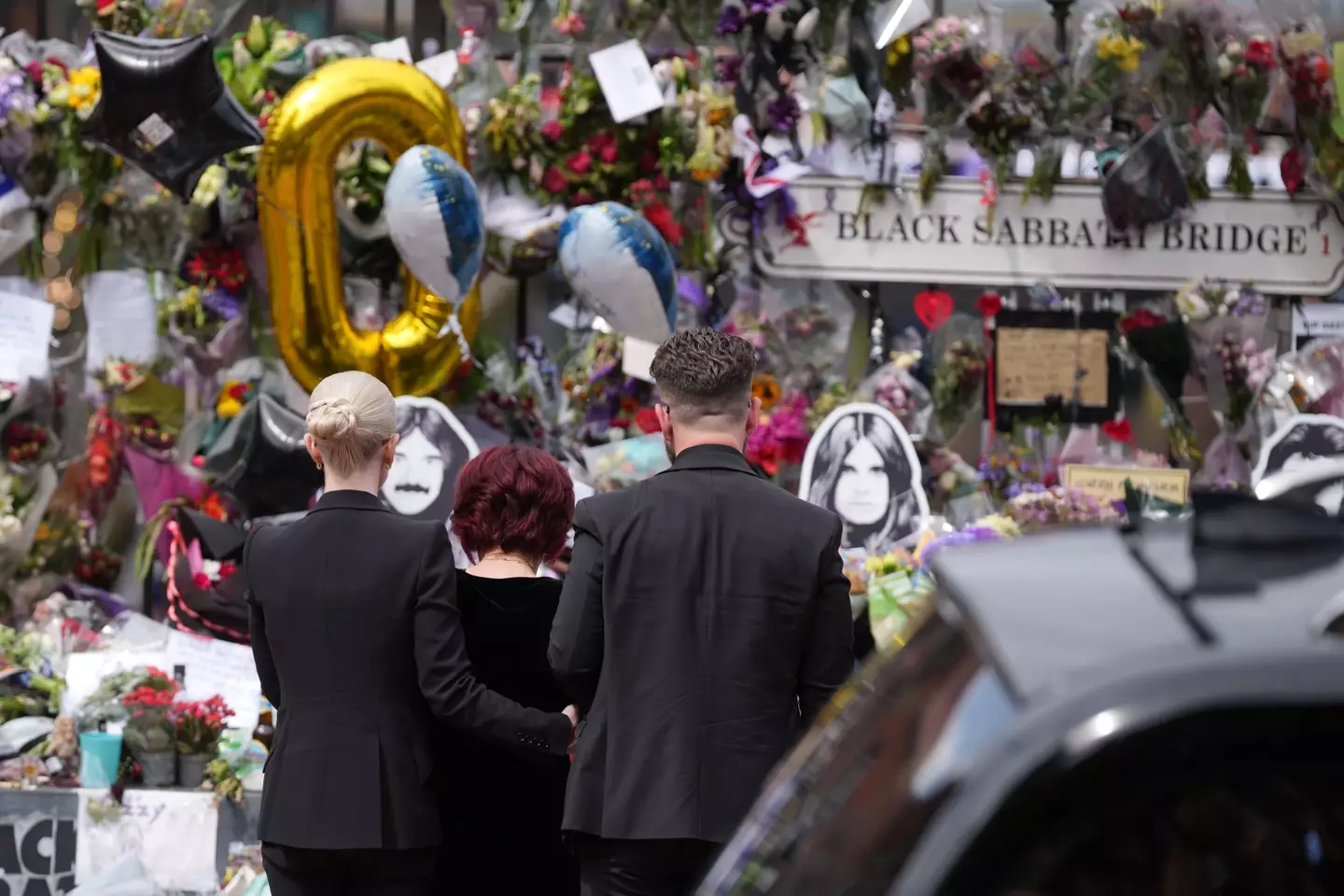 The family visited tributes at Black Sabbath bridge and bench (Christopher Furlong/Getty Images)