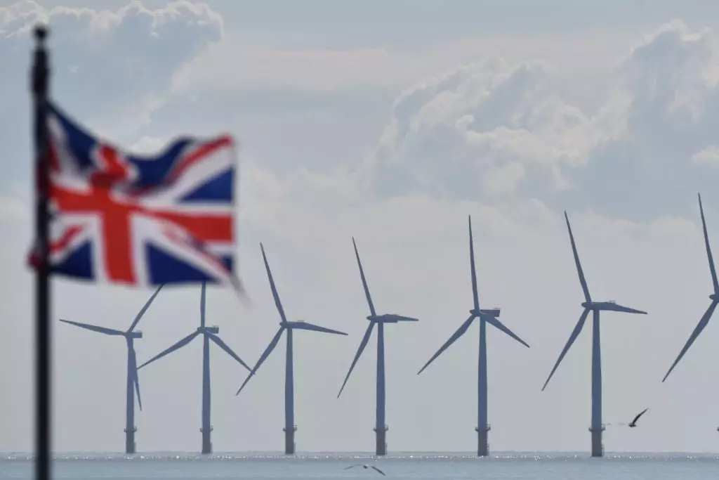More wind farms and solar panels are needed to generate extra electricity without having to use fossil fuels to fill the gap (Photo by John Keeble/Getty Images)