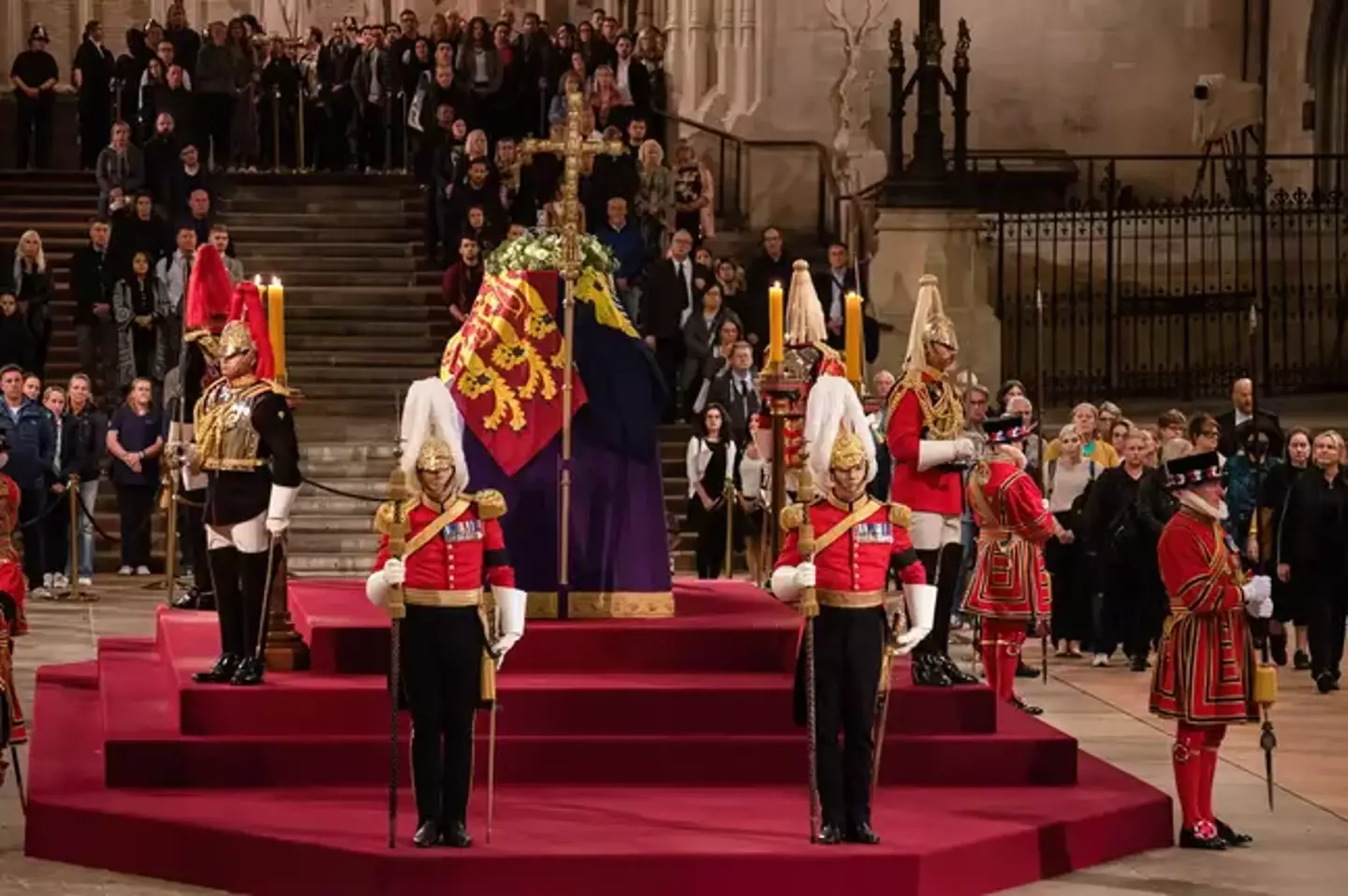 The Queen's coffin is surrounded by guards.