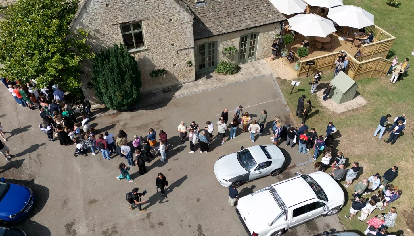 Aerial view of the queue to get inside Clarkson's pub on opening day (Ben Birchall/PA Wire)