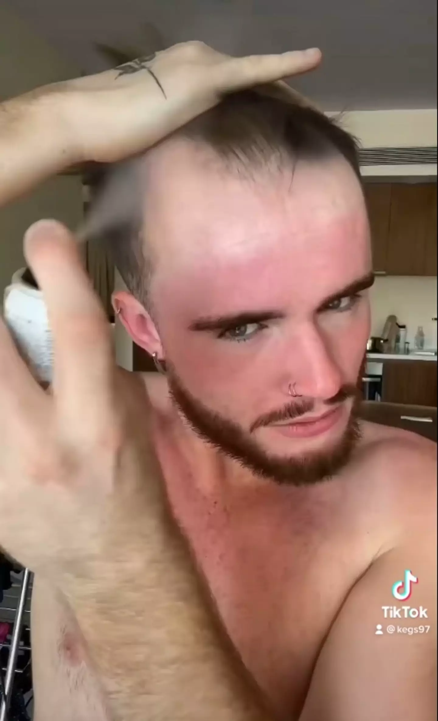 Kegs spraying his hair on.