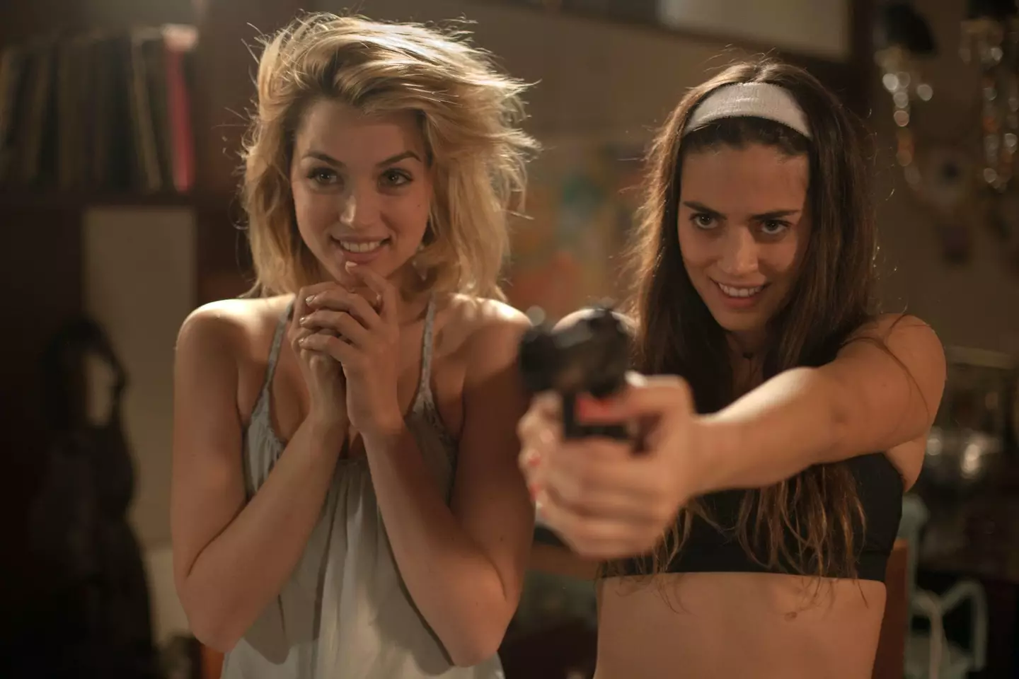 Lorenza Izzo and Ana de Armas star as the deadly strangers in the 2015 film.