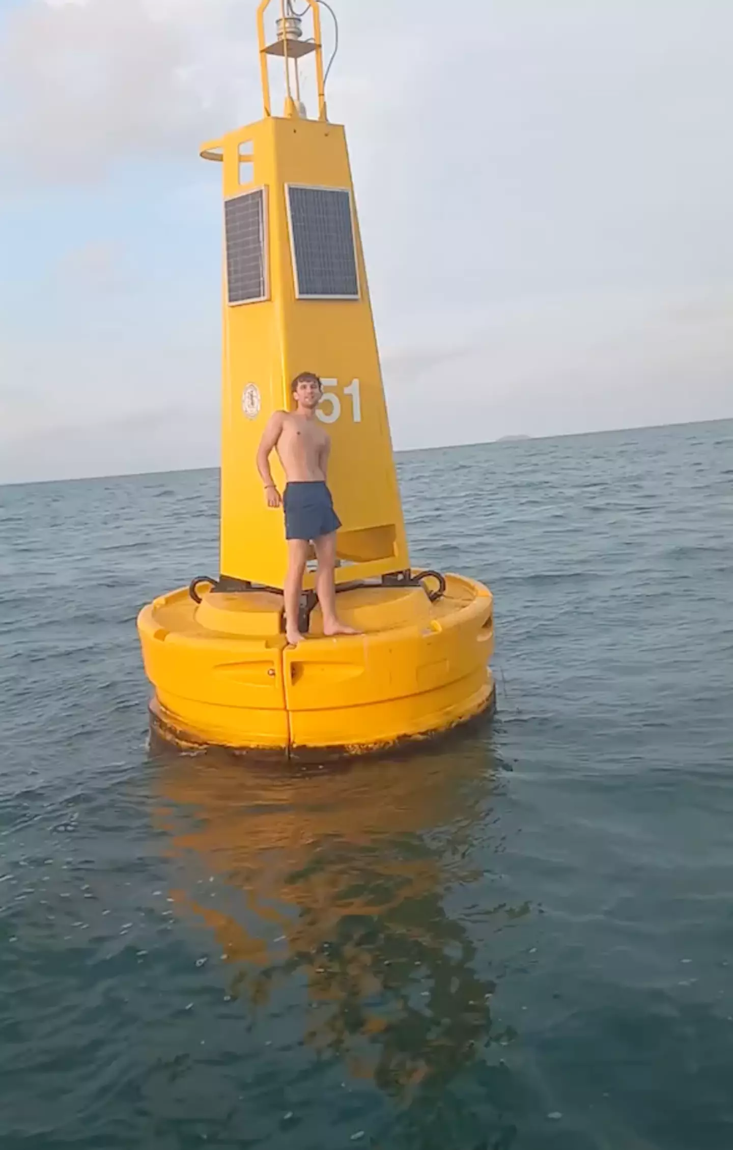 The British tourist swam out to sea and was too tired to make it back to the beach, so he climbed onto a buoy and hitched a lift.