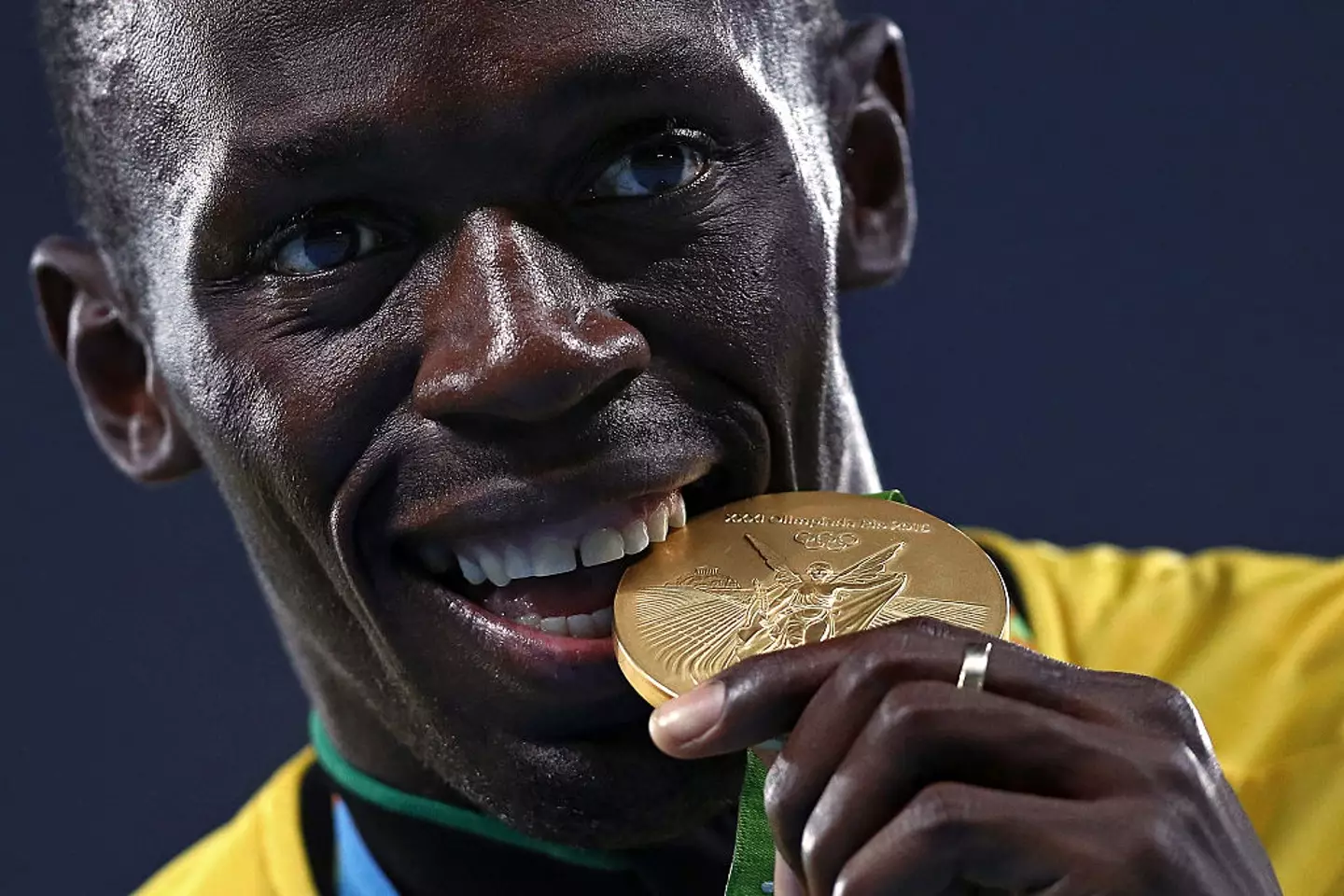 Usain Bolt biting one his golds in the 2016 Games (Patrick Smith/Getty Images)