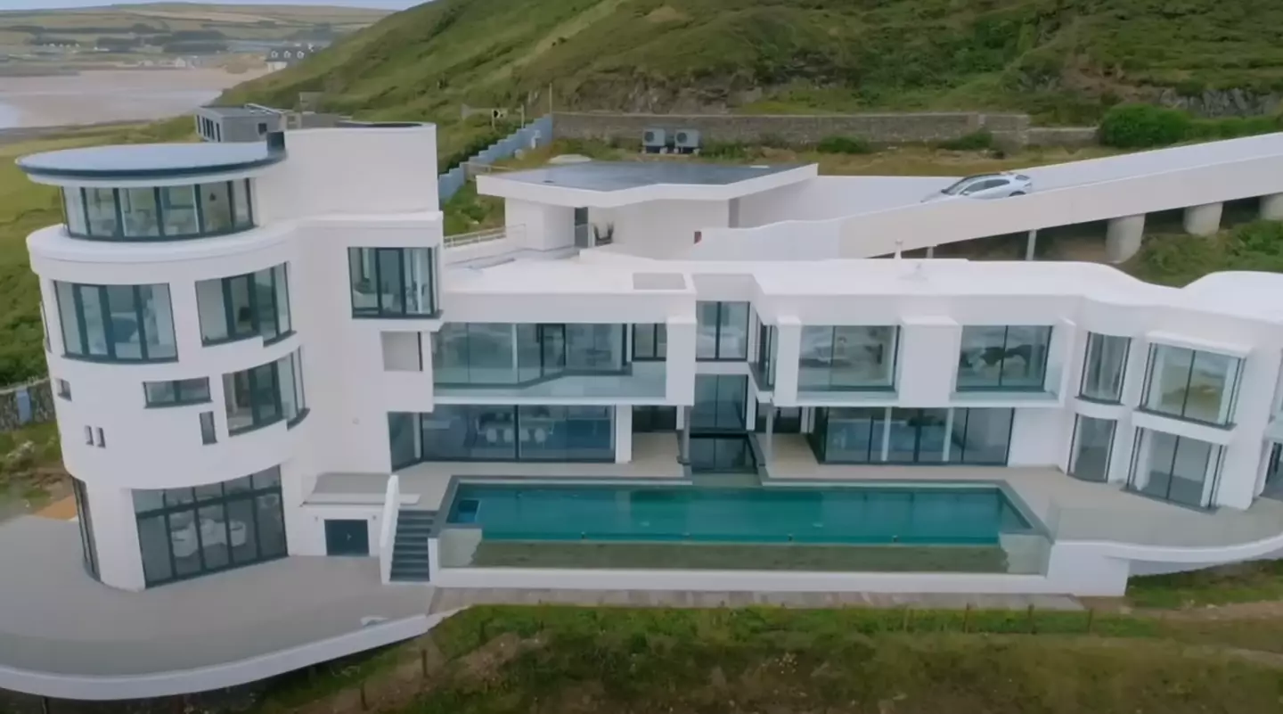 The impressive property sits on a cliff.