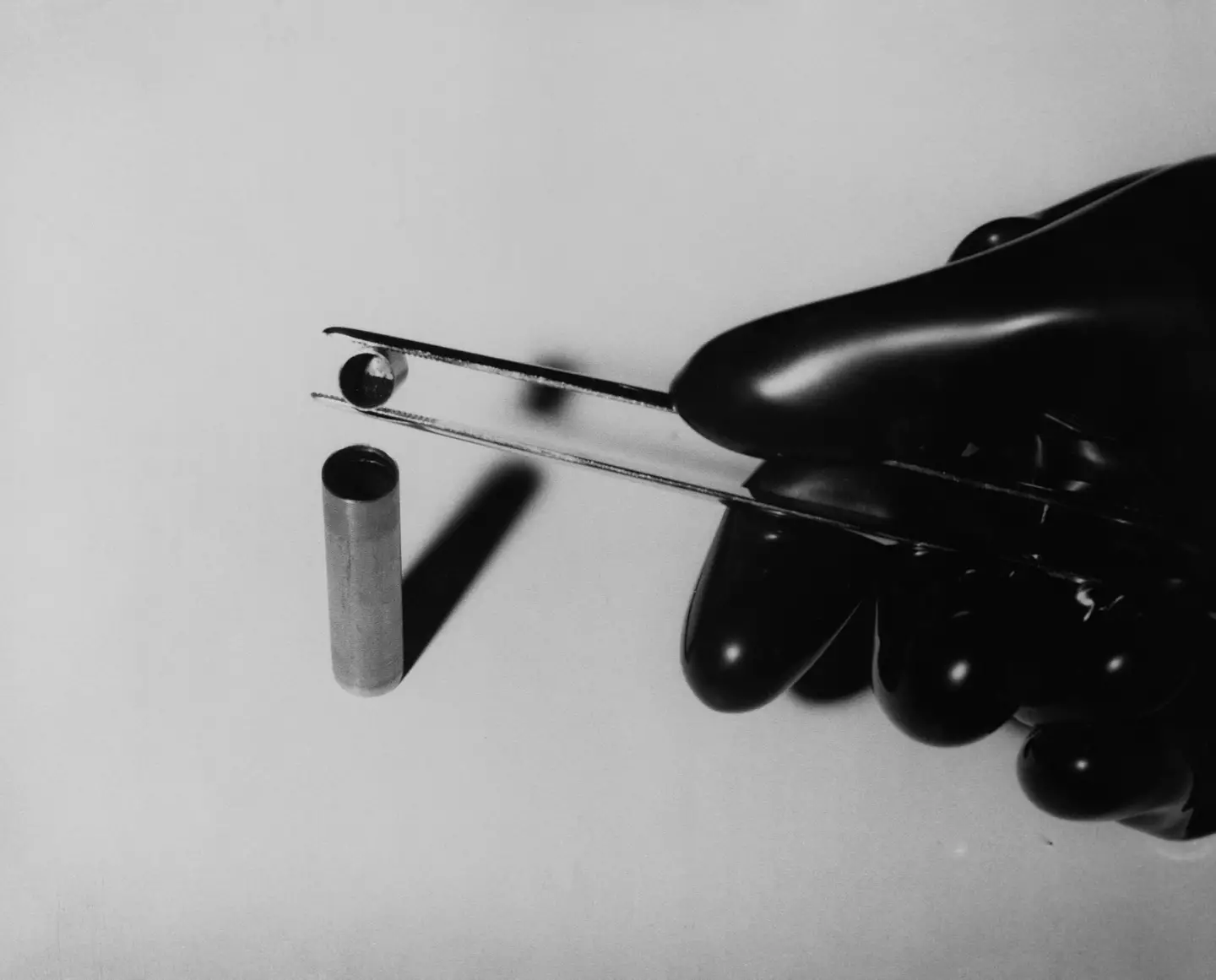 A radioactive substance being poured into a tantalum capsule.