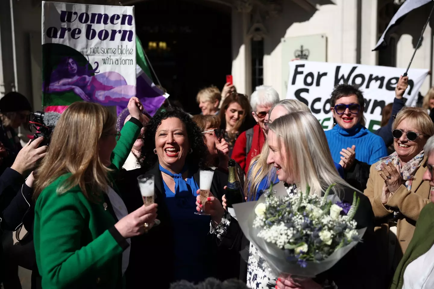 FWS and supporters outside the Supreme Court this morning. ( HENRY NICHOLLS / AFP) (Photo by HENRY NICHOLLS/AFP via Getty Images)