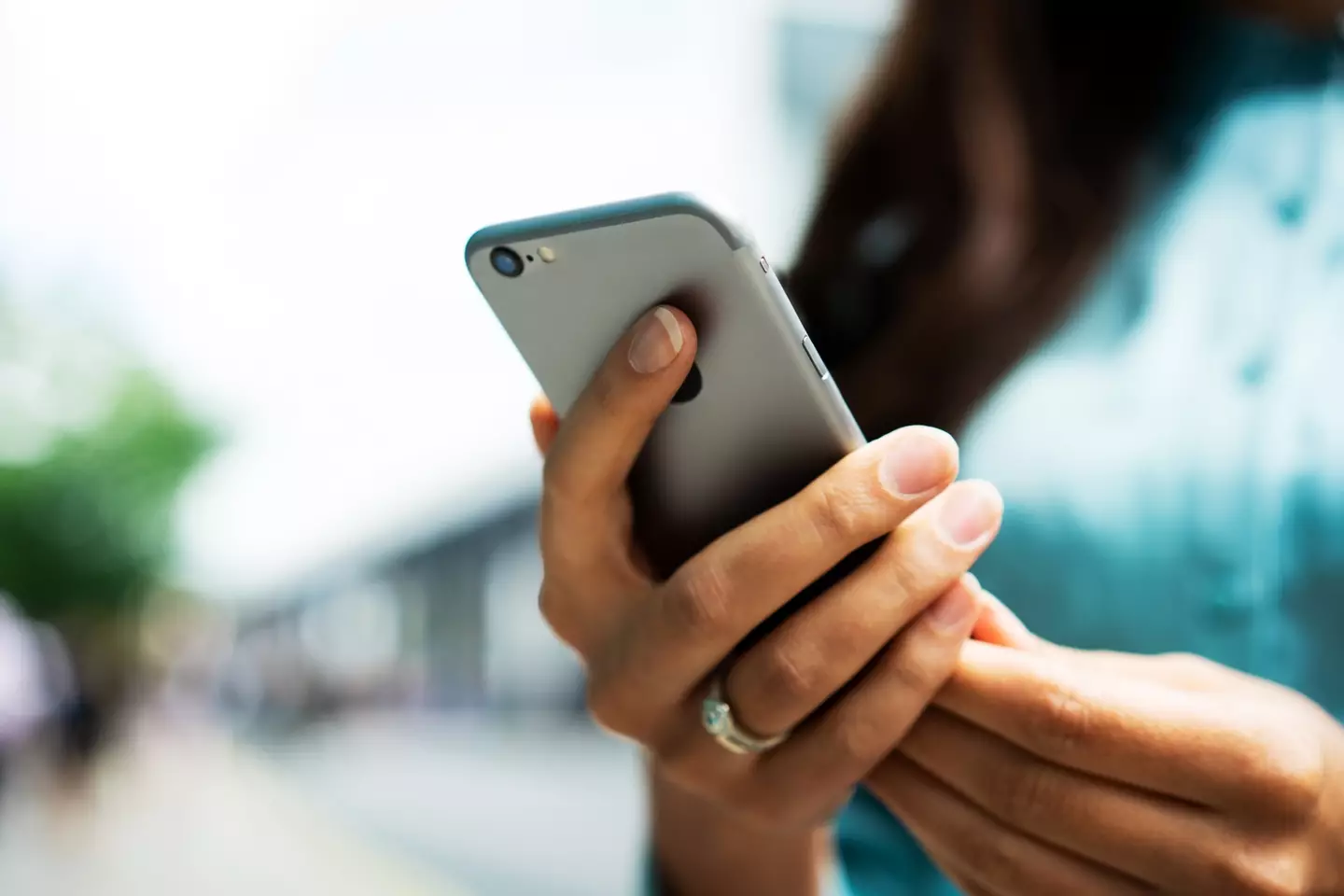 The unnamed woman looked at her husband's phone. (Getty stock photo)