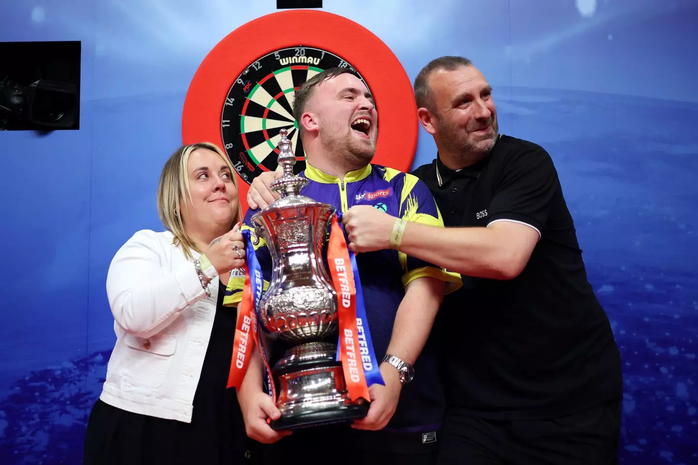 Littler with his parents at the 2025 Betfred World Matchplay in July.(Lewis Storey/Getty Images)