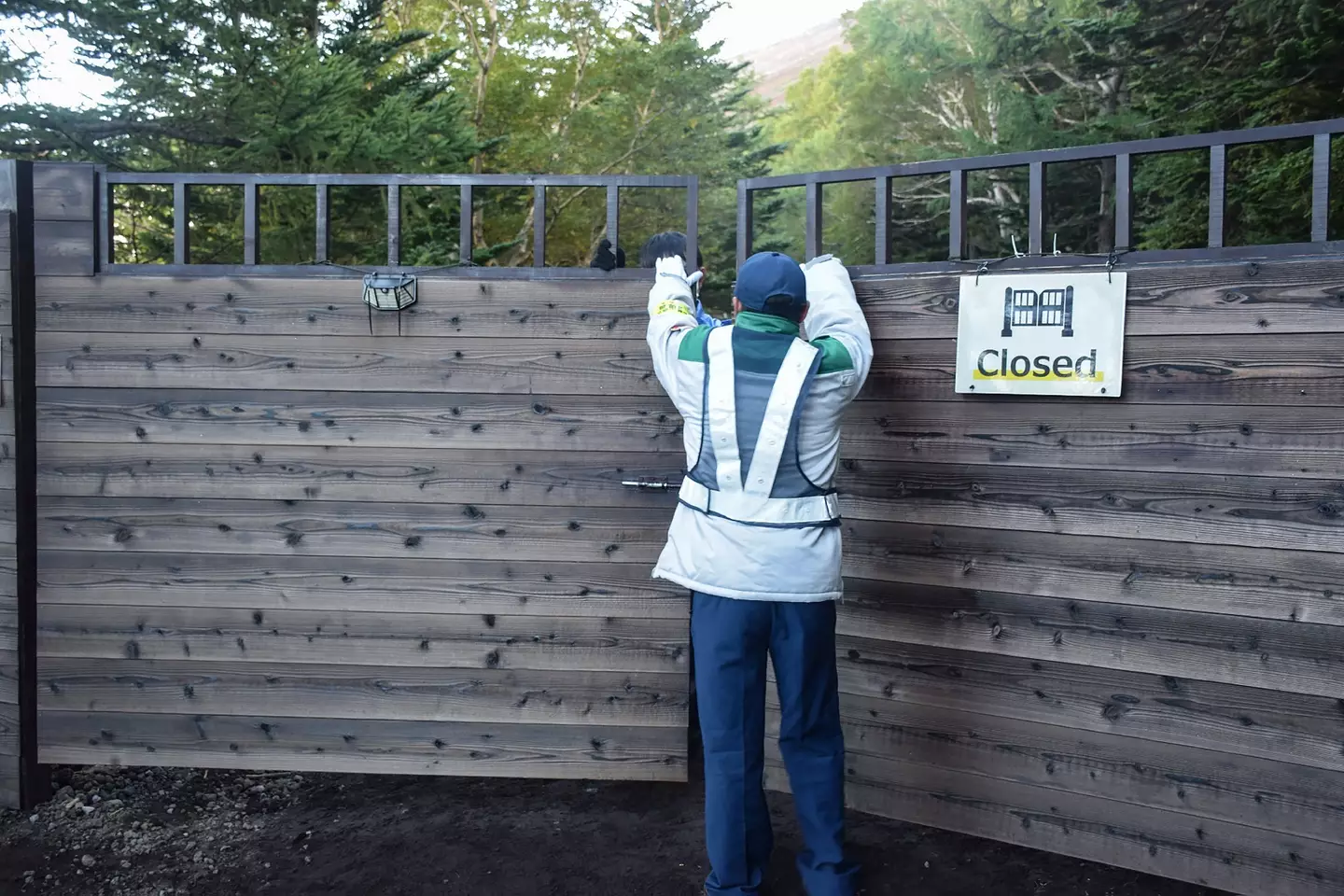 The climbing trails are meant to be closed during the off season (STR/JIJI Press/AFP via Getty Images)