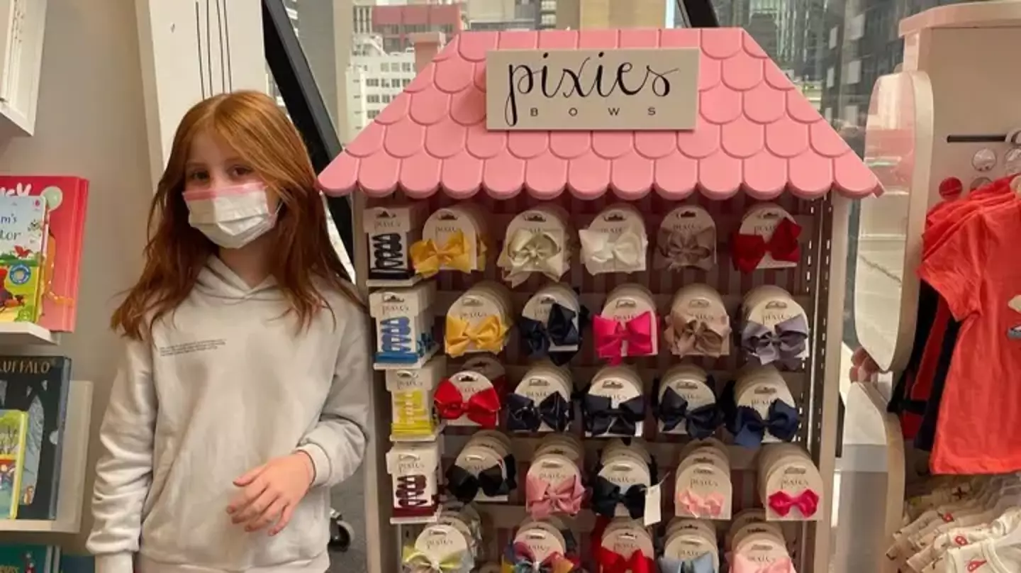 Pixie Curtis with a rack of bows from her very own business.