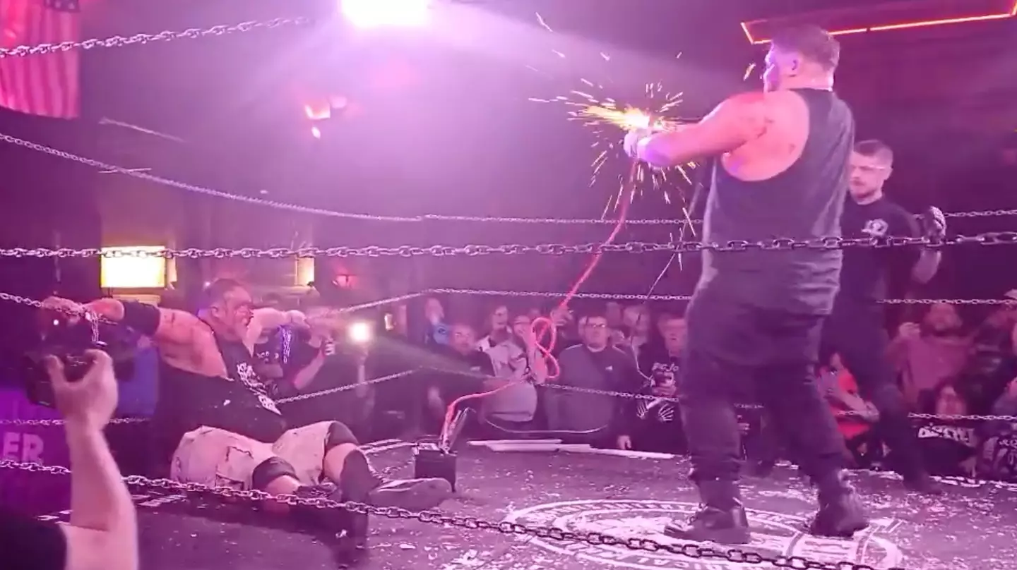 Sparks flew from the jump leads before Isaac appeared to start convulsing (X/@BritWresAwayDay)
