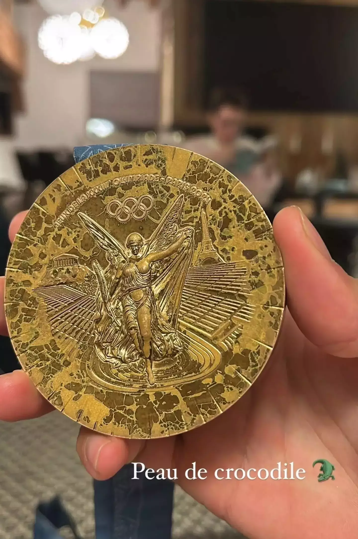 An Olympic gold medal from the Paris 2024 Games looking in poor shape (Instagram/@clem_secchi)