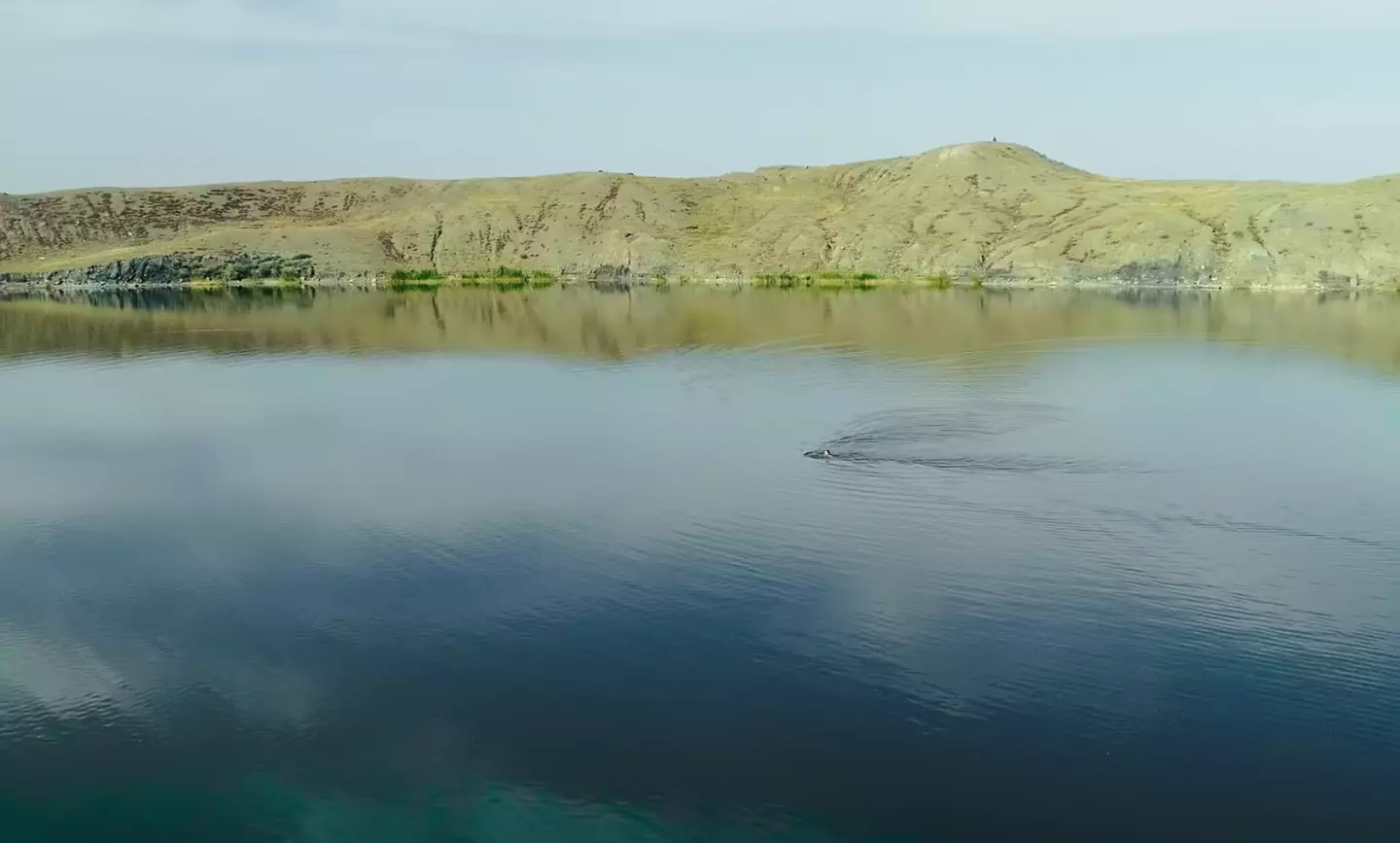 The lake is still radioactive decades after the area stopped being a nuclear testing site, but people fish and swim in it (Netflix)