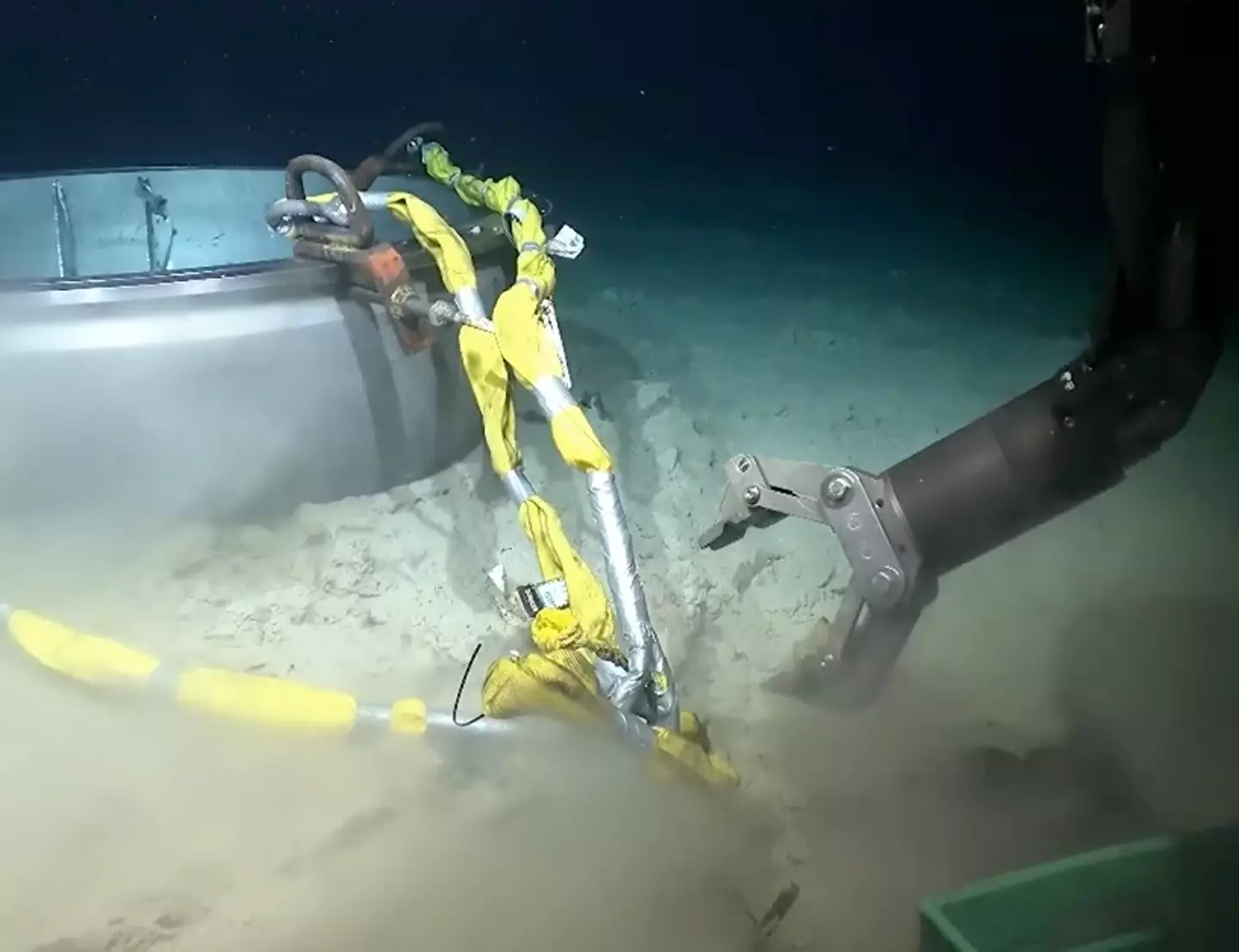 The US Coast Guard has shared a clip showing the moment a robot salvages what's left of the Titan sub (US Coast Guard)