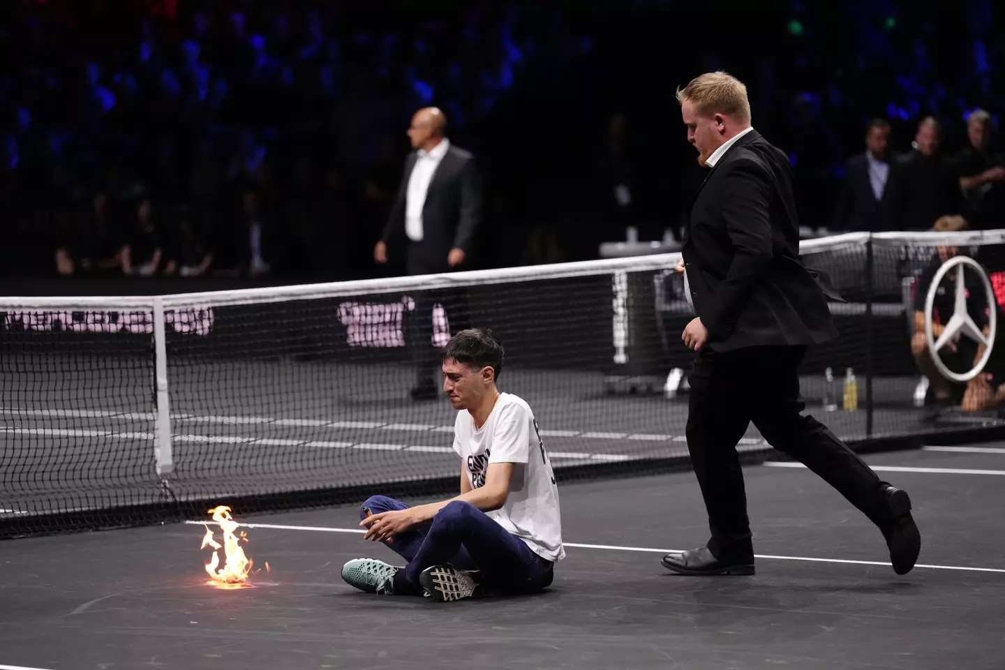 The protester set himself on fire ahead of Roger Federer's final match.