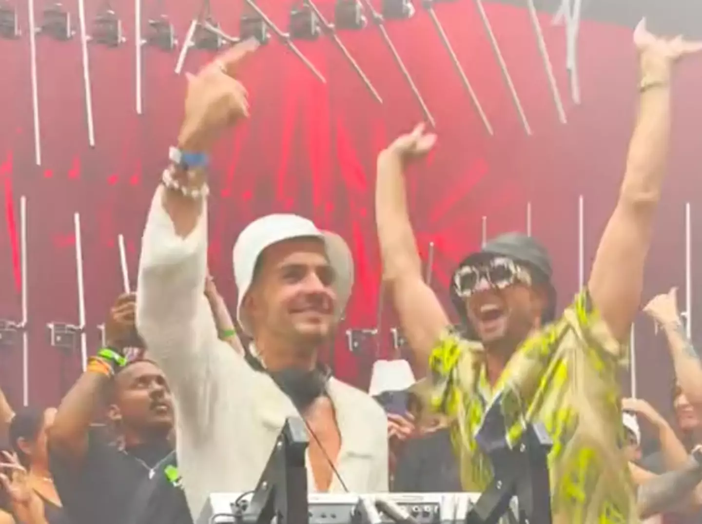 Jack Grealish wore headphones as he jumped with the crowd.