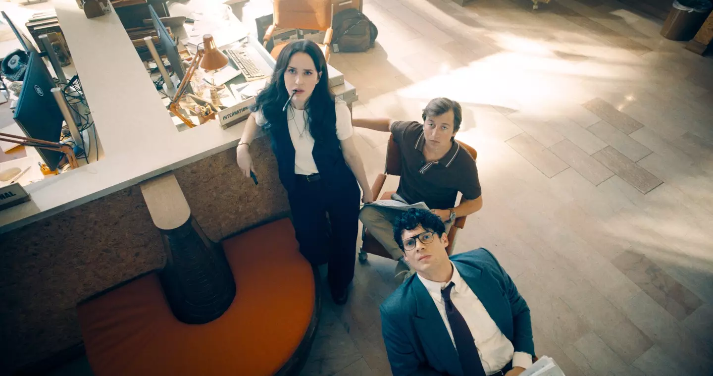 Rachel Brosnahan, Nicholas Hoult and David Corenswet looking up at camera as their Superman characters, Warner Bros. Pictures