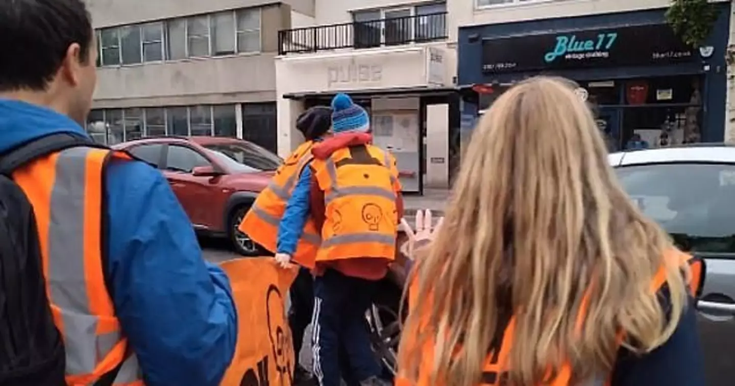 A furious driver has been filmed running over the foot of a Just Stop Oil protester.