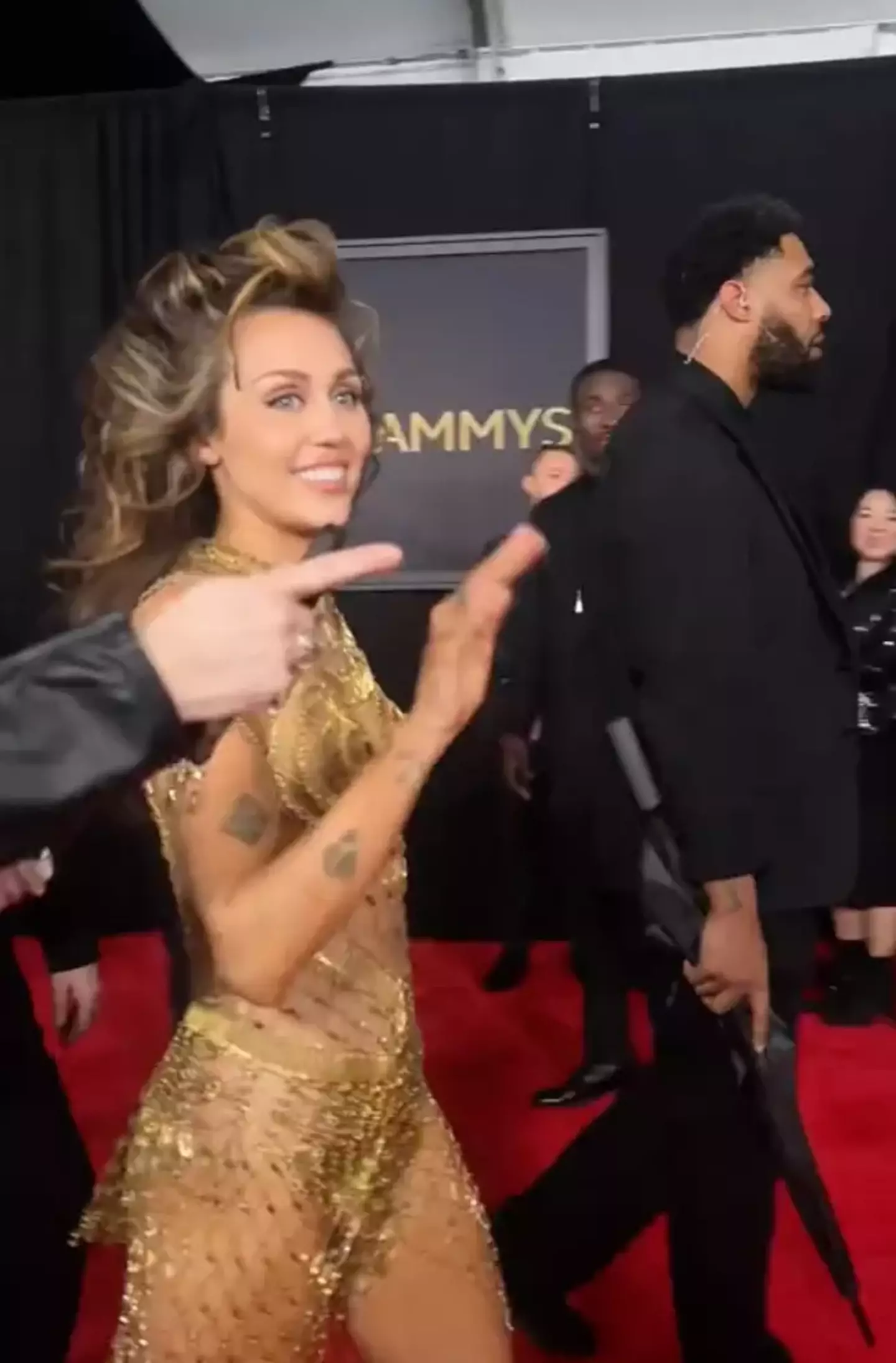 Many eyes were on Miley Cyrus at the Grammys, but lots of eyes were drawn to her bodyguard.