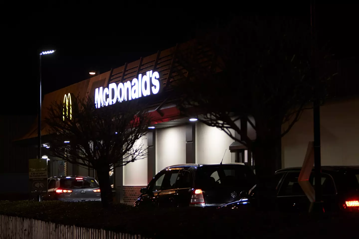 Apparently, it's against the law to pay at a drive-through with your phone while the car engine in still running.