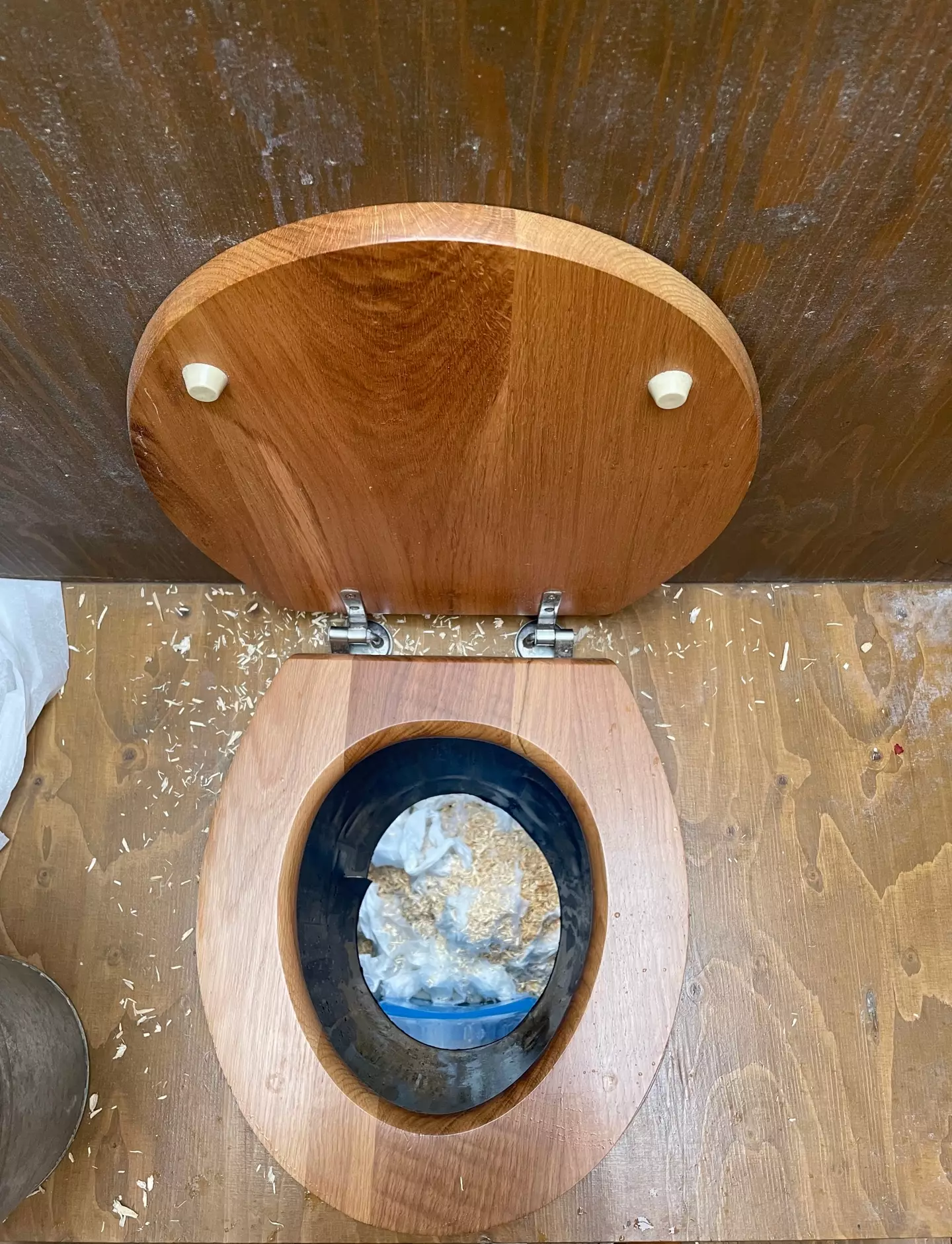 Customers at Frank's are asked to throw sawdust after they've finished in the toilet (