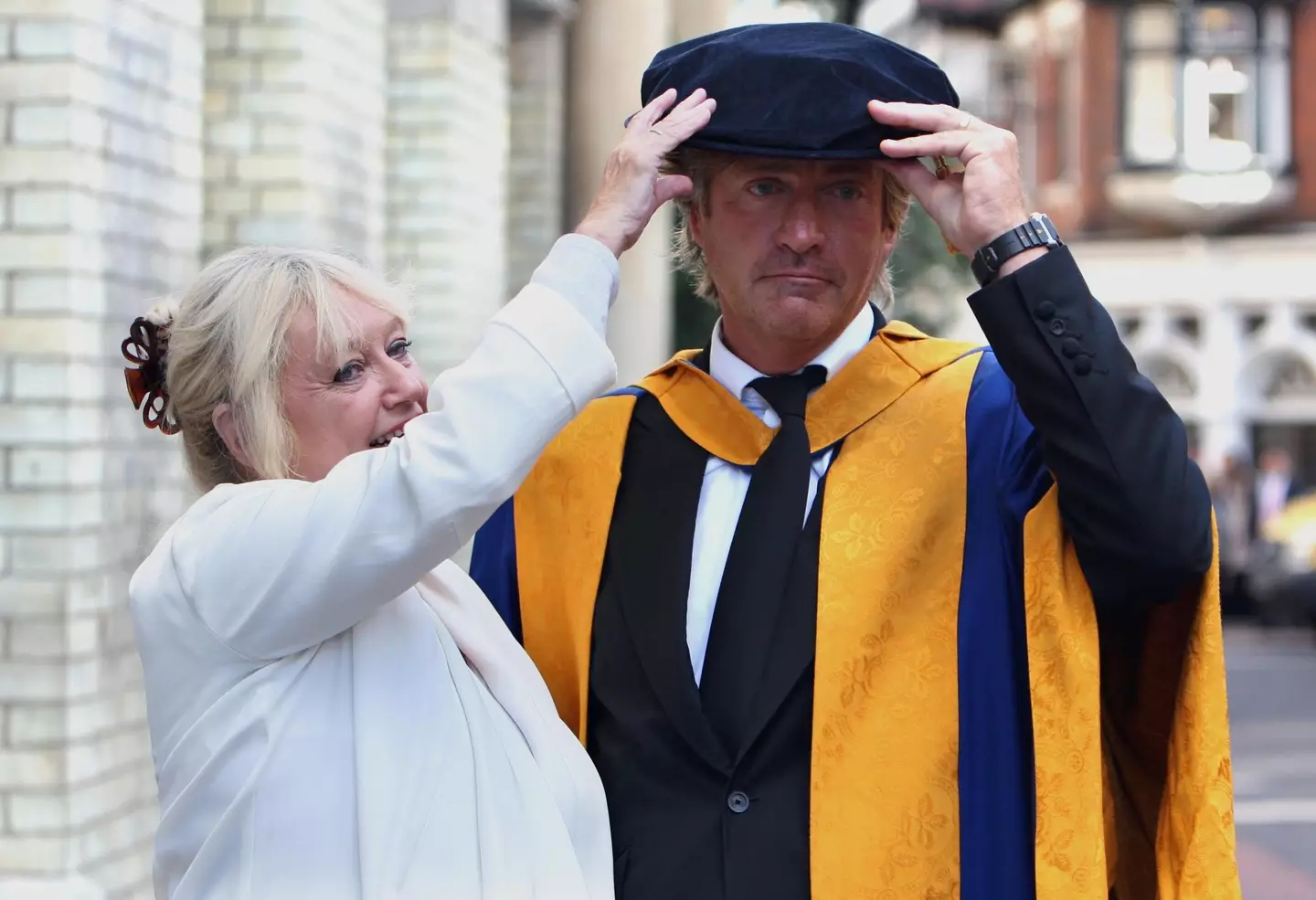 Broadcaster Richard Madeley and his wife Judy pose for a photograph after he received an honorary degree from the Anglia Ruskin University in Cambridge, Cambridgeshire.