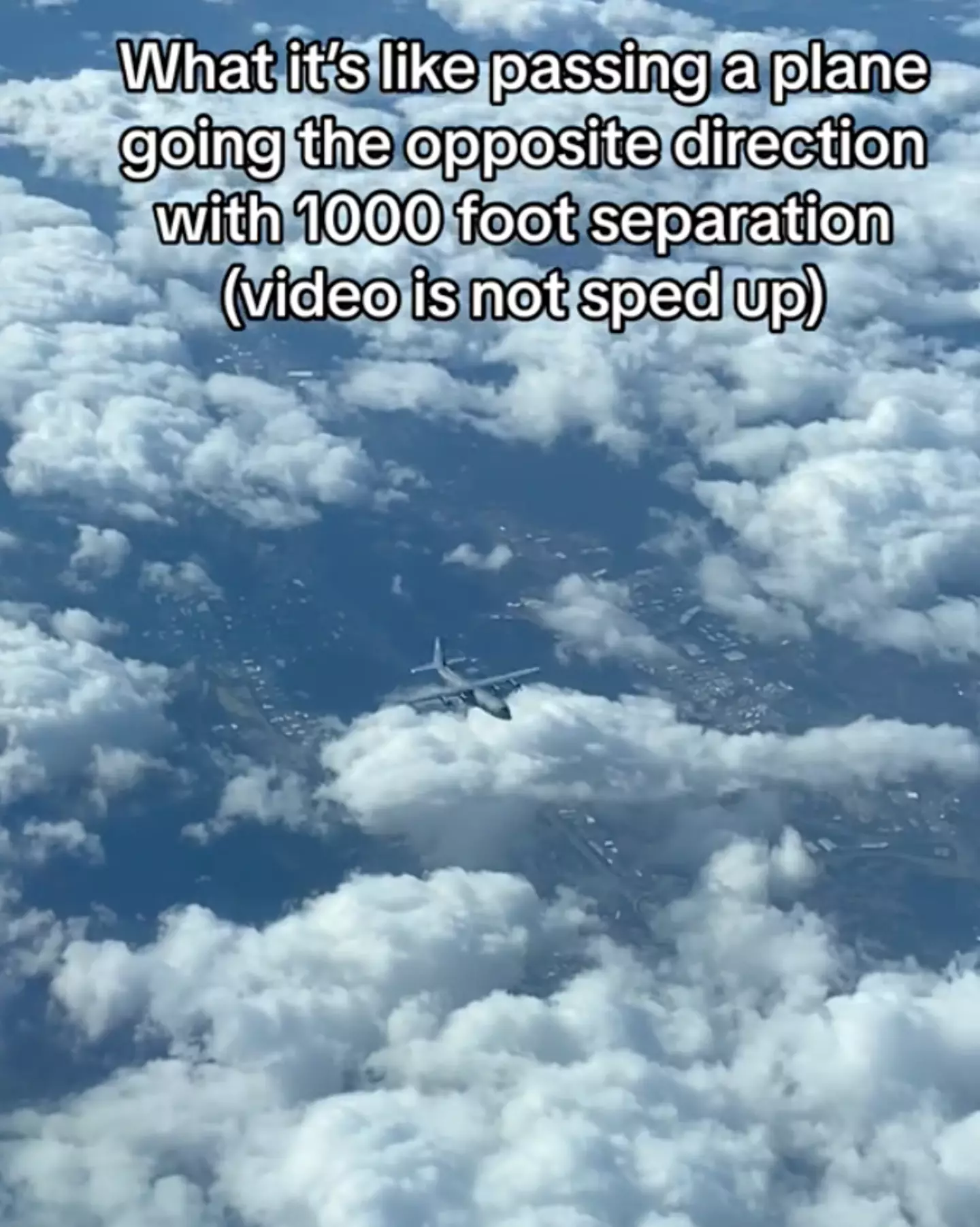 The video shows two military planes passing each other at a height difference of just 1,000 feet.