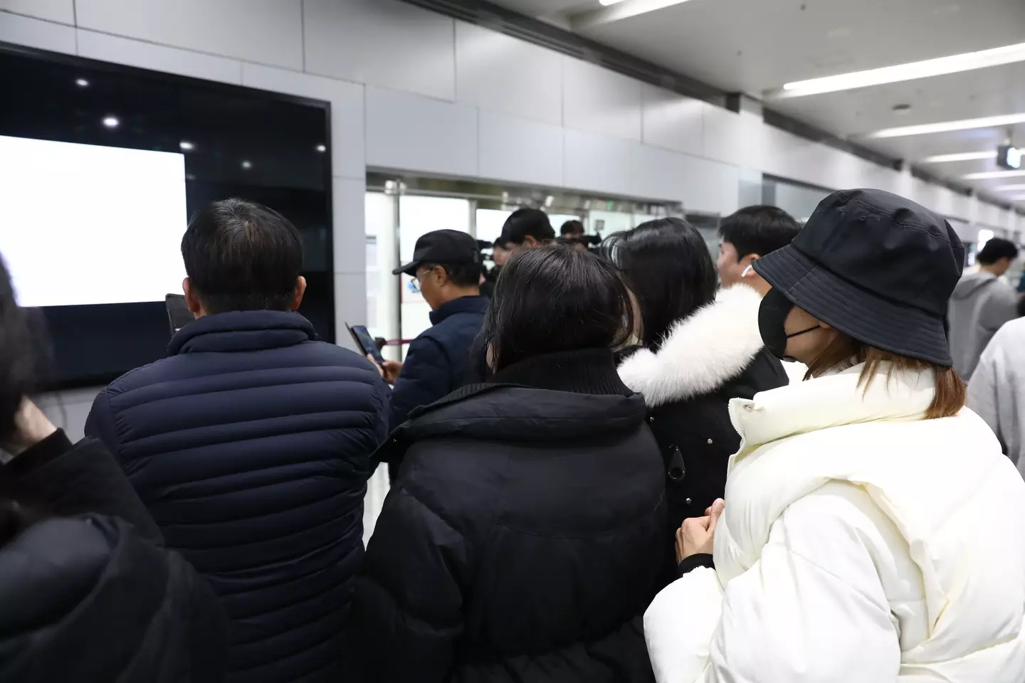 Families have been grieving in the airport (Chung Sung-Jun/Getty Images)