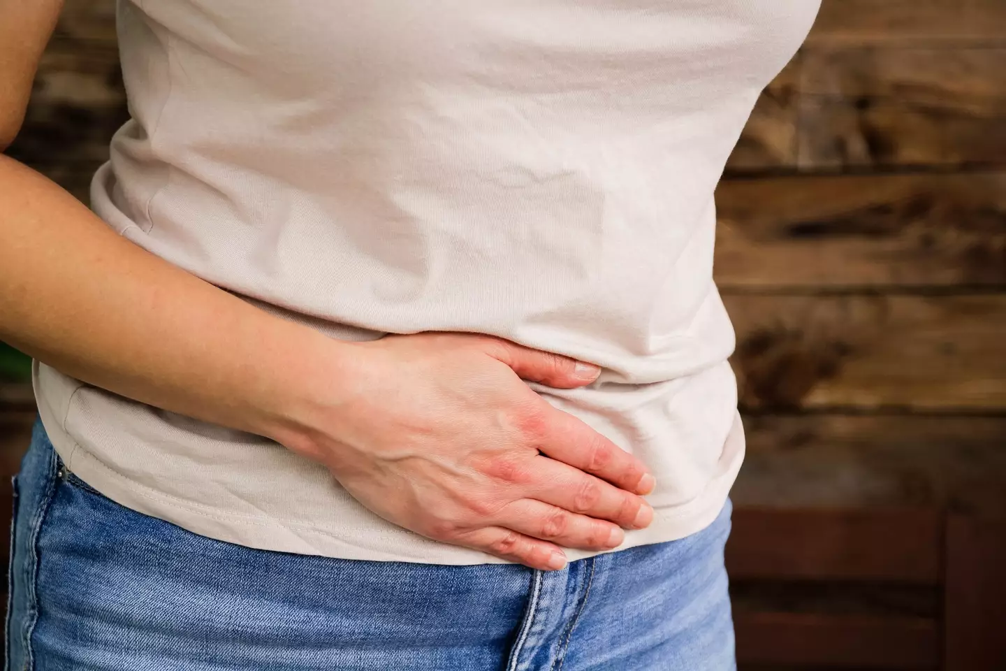 Tummy pain is one of the symptoms of bowel cancer (Getty stock images)