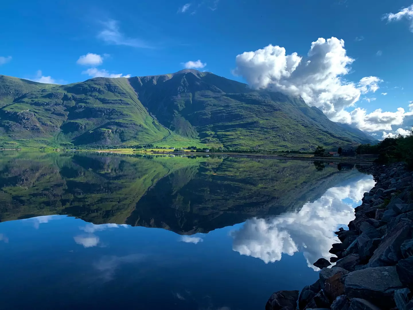 The mountains of Torridon, Scotland reflected in the sea loch below (Supplied)