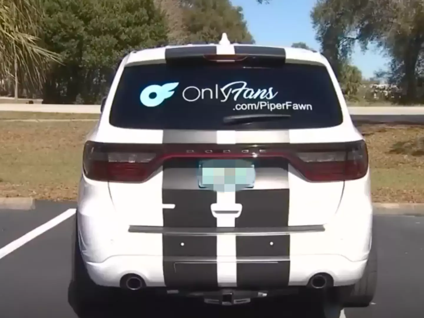 Michelle Cline advertises her OnlyFans account on her car.
