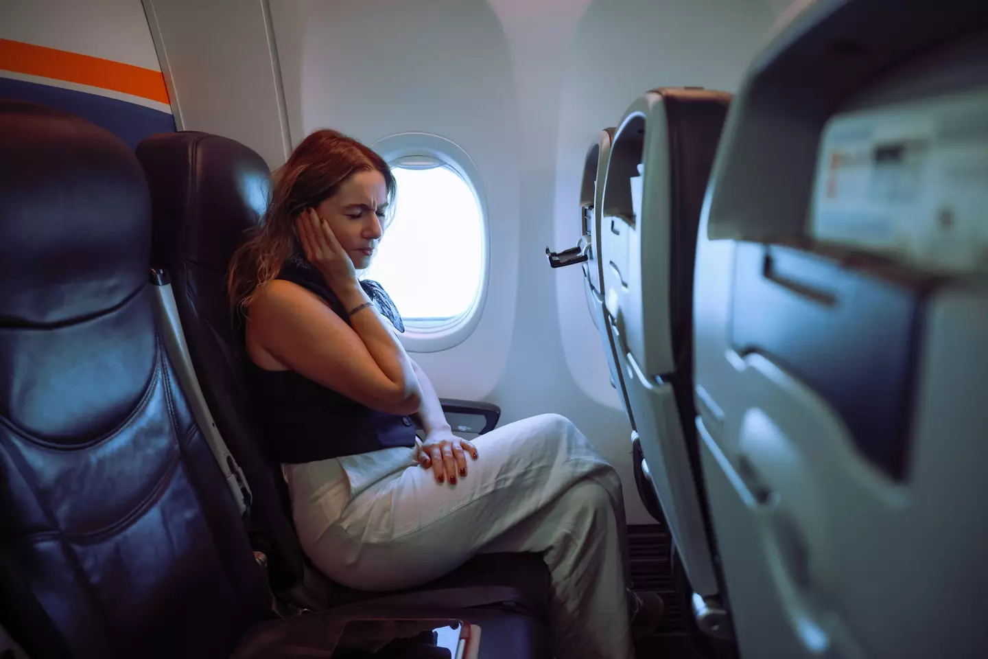 Kat explained what flying does to your body (ozgurcankaya/ Getty Stock)