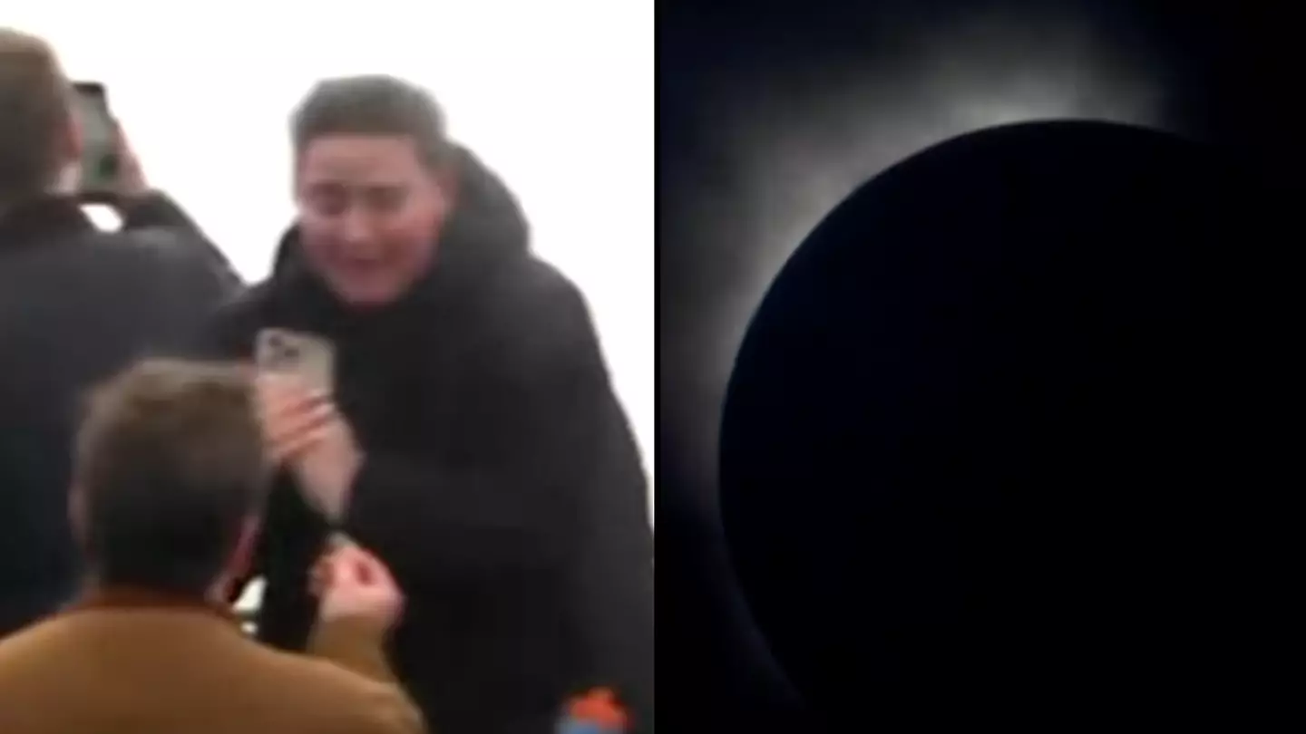 Man gets down on one knee as sky plunges into darkness during Niagara Falls solar eclipse