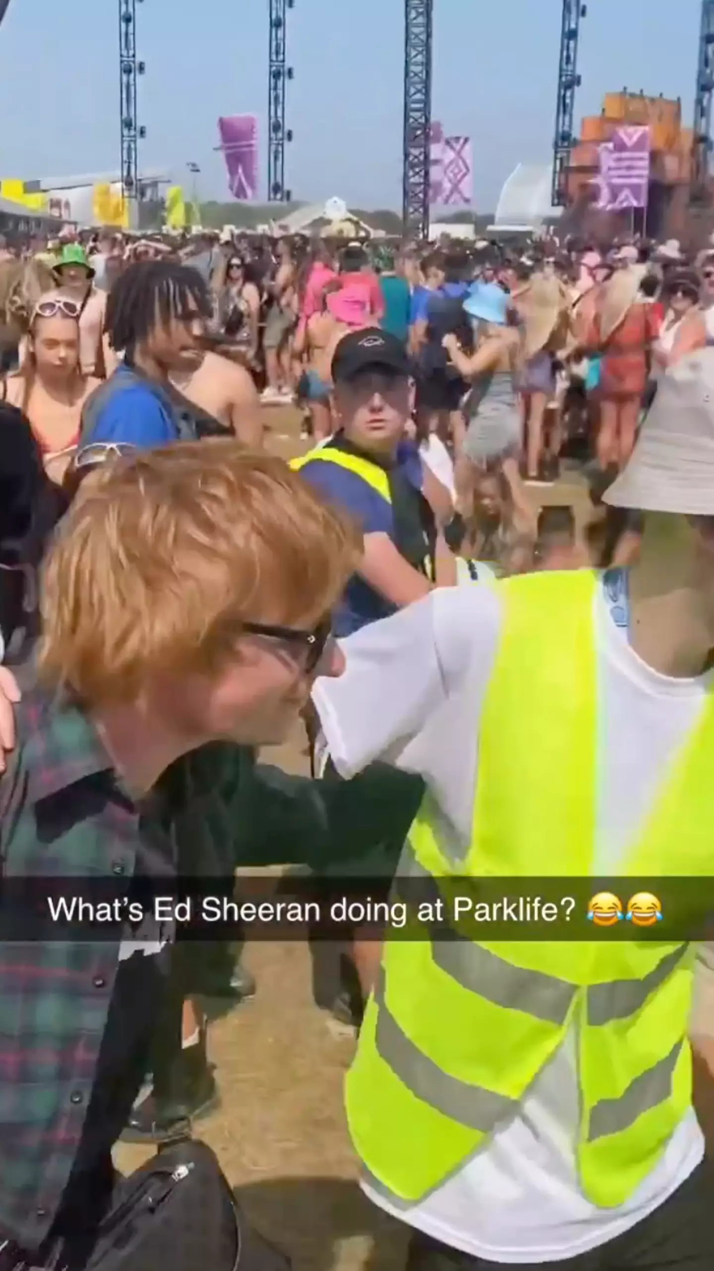 One fan can be heard repeatedly shouting Ed Sheeran's name as the man walked through the crowds.
