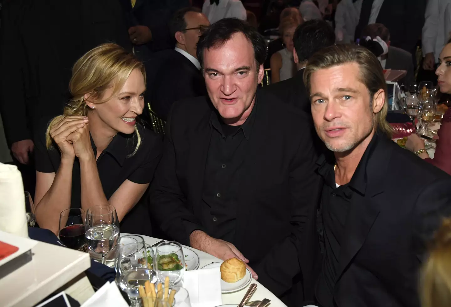 Uma Therman with Tarantino and Pitt.