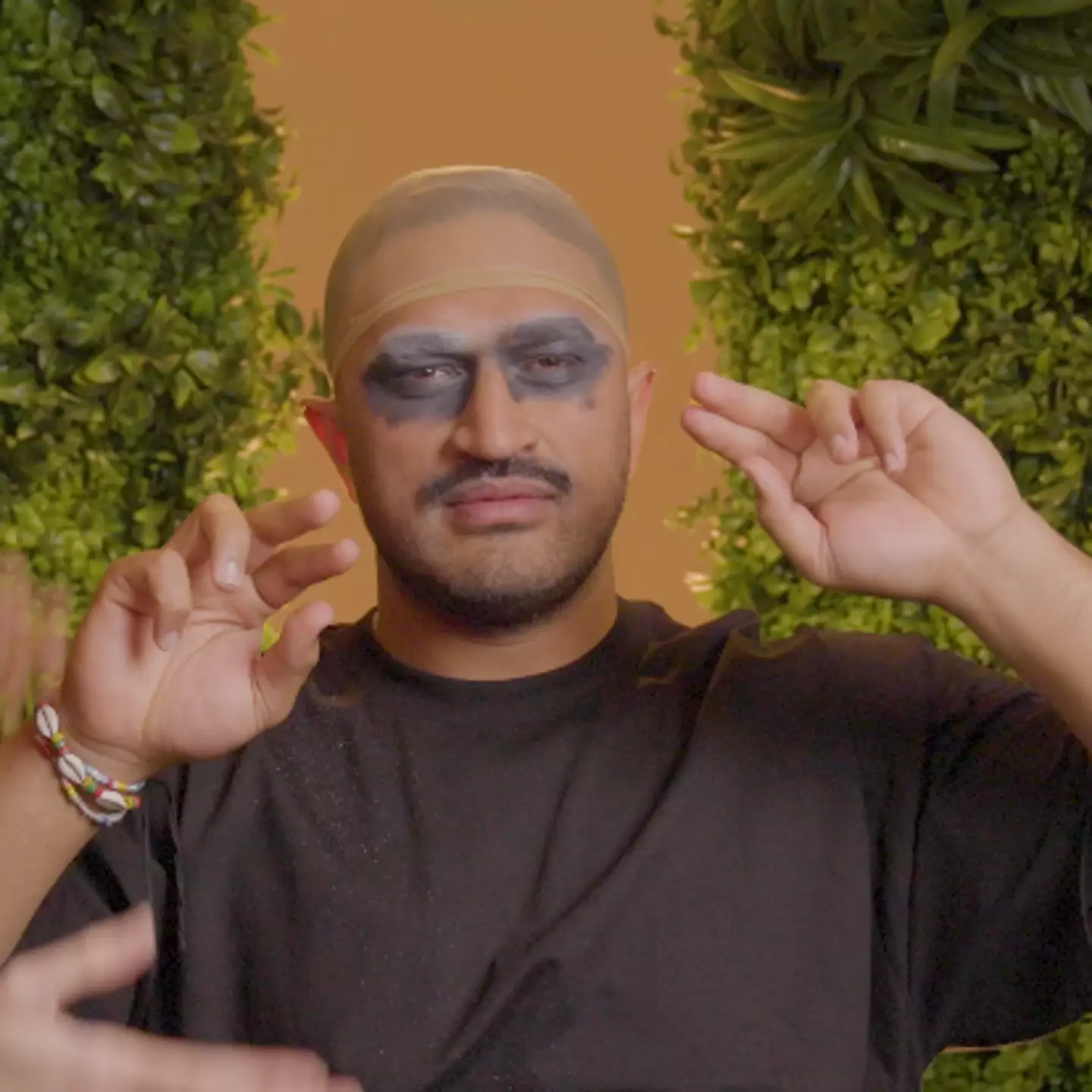 Jordan River, confused by the wig cap.