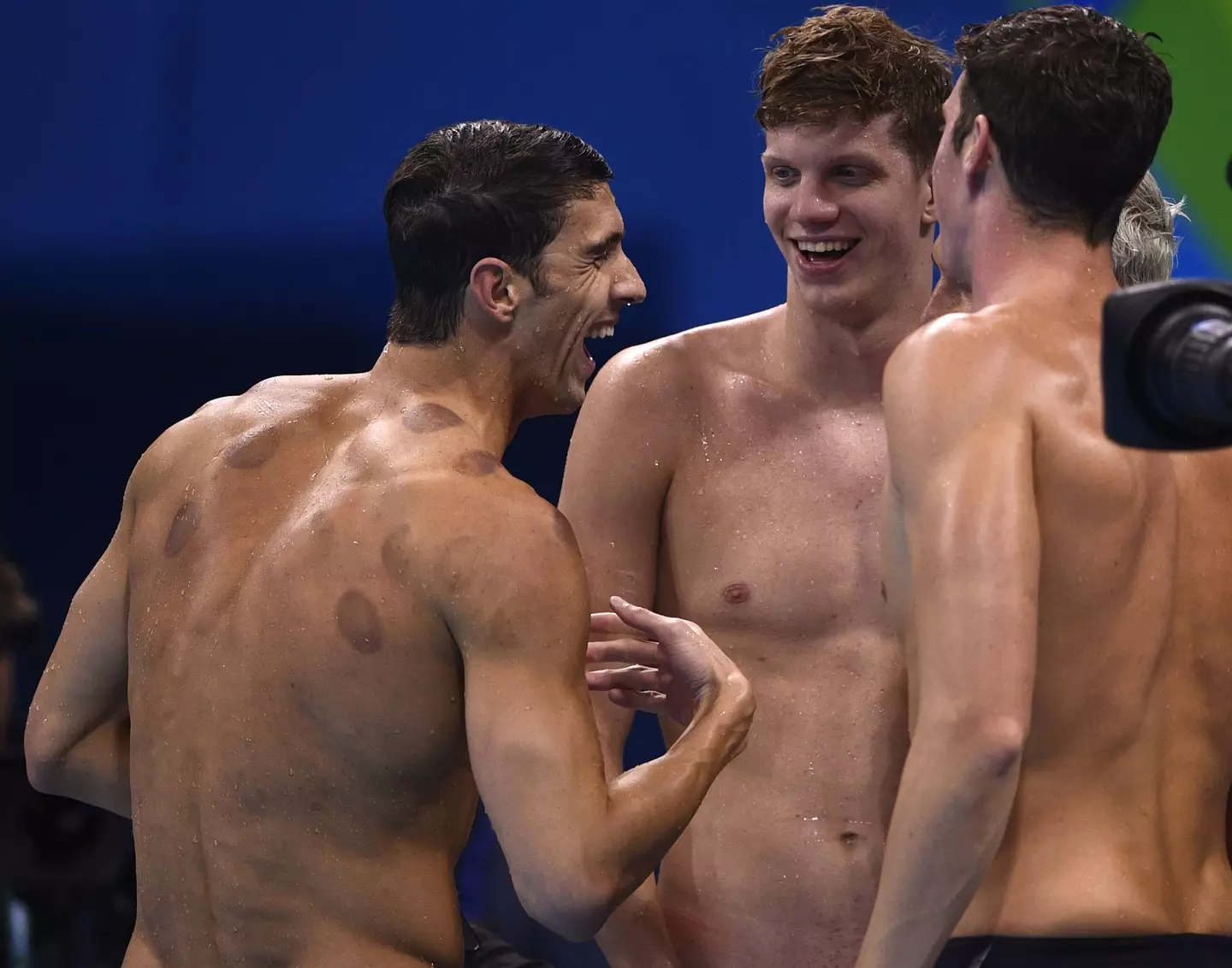 Michael Phelps celebrating gold with Ryan Lochte and Conor Dwyer. (MARTIN BUREAU/AFP via Getty Images)