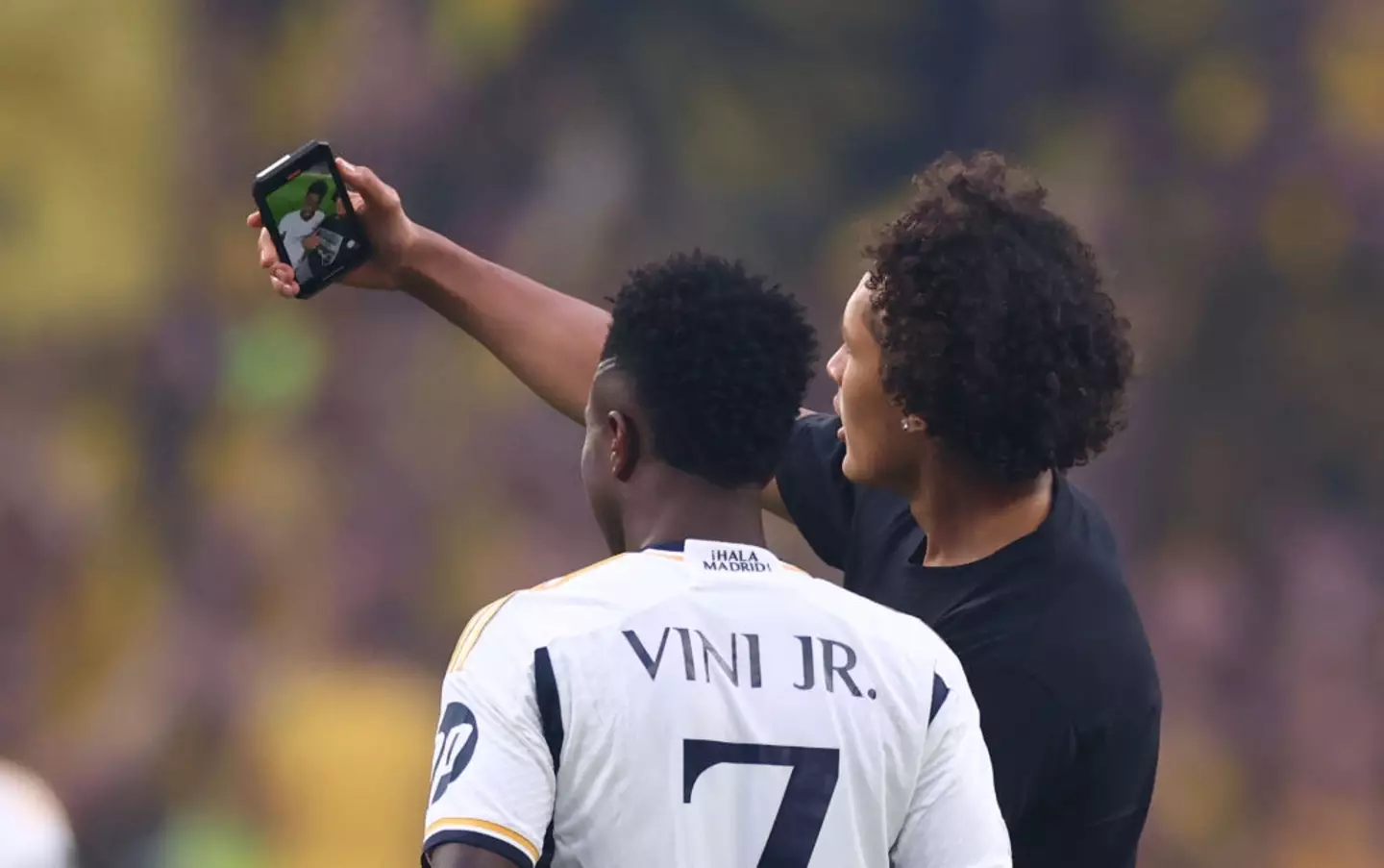 The pitch invaders face a lengthy stadium ban. (Marc Atkins/Getty Images)